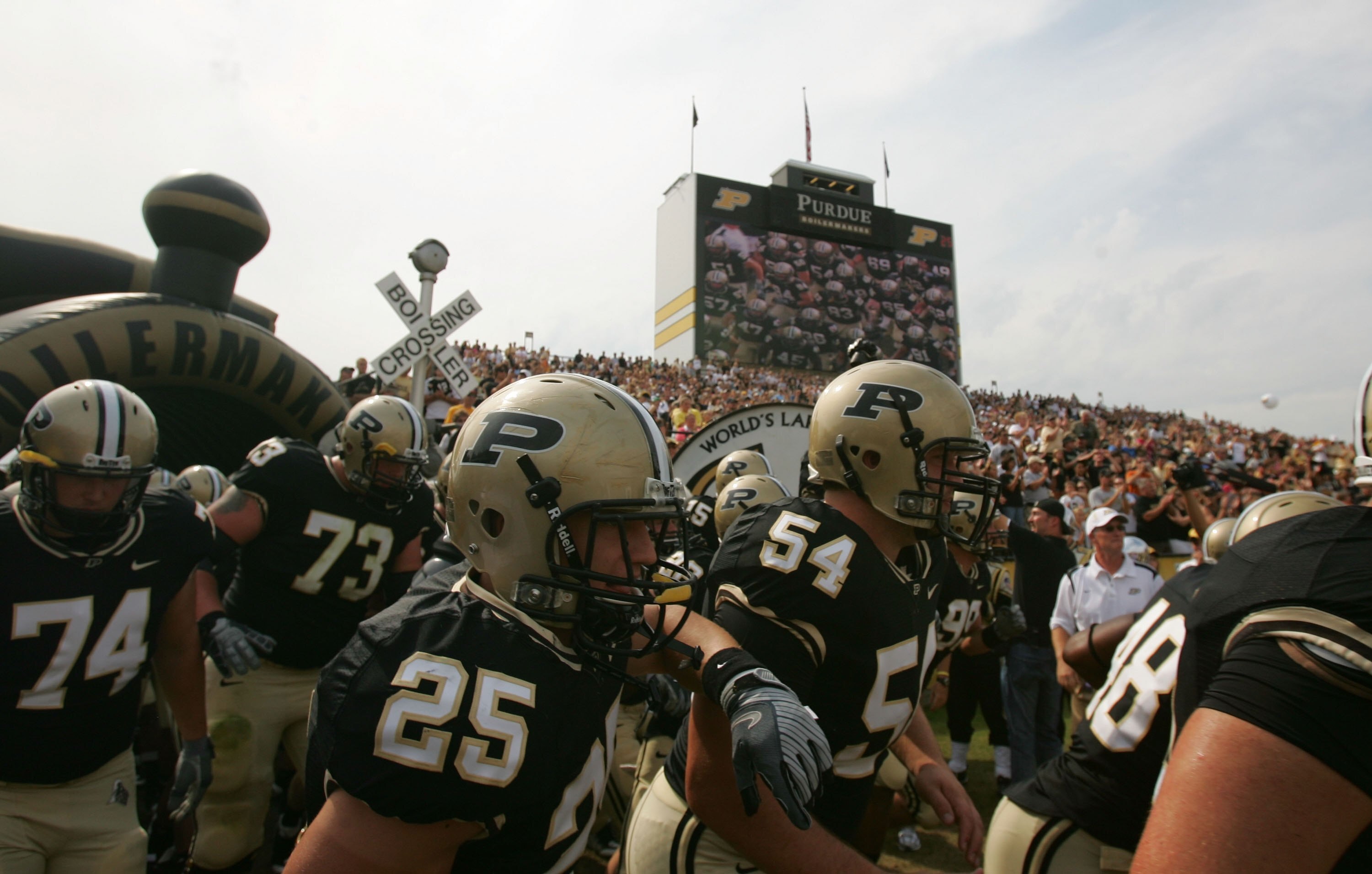 WEST LAFAYETTE, IN - SEPTEMBER 20:  The Purdue Boilermakers run on the field before play against the Central Michigan Chippewas at Ross-Ade Stadium on September 20, 2008 in West Lafayette, Indiana.  (Photo by Ronald Martinez/Getty Images)