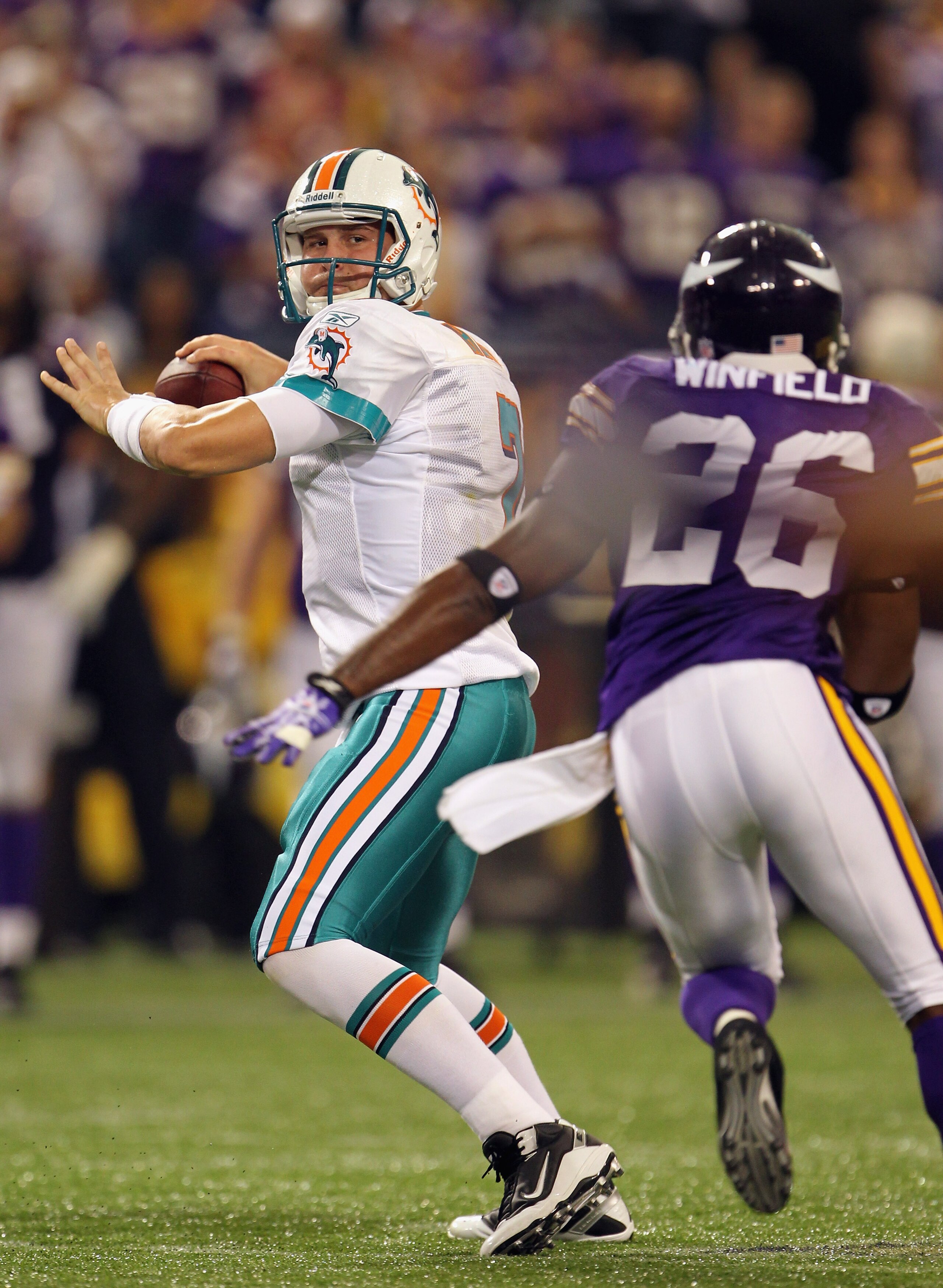 MINNEAPOLIS - SEPTEMBER 19:  Quarterback Chad Henne #7 of the Miami Dolphins passes as Antoine Winfield #26 of the Minnesota Vikings defends during the game on September 19, 2010 at Hubert H. Humphrey Metrodome in Minneapolis, Minnesota.  (Photo by Jamie 