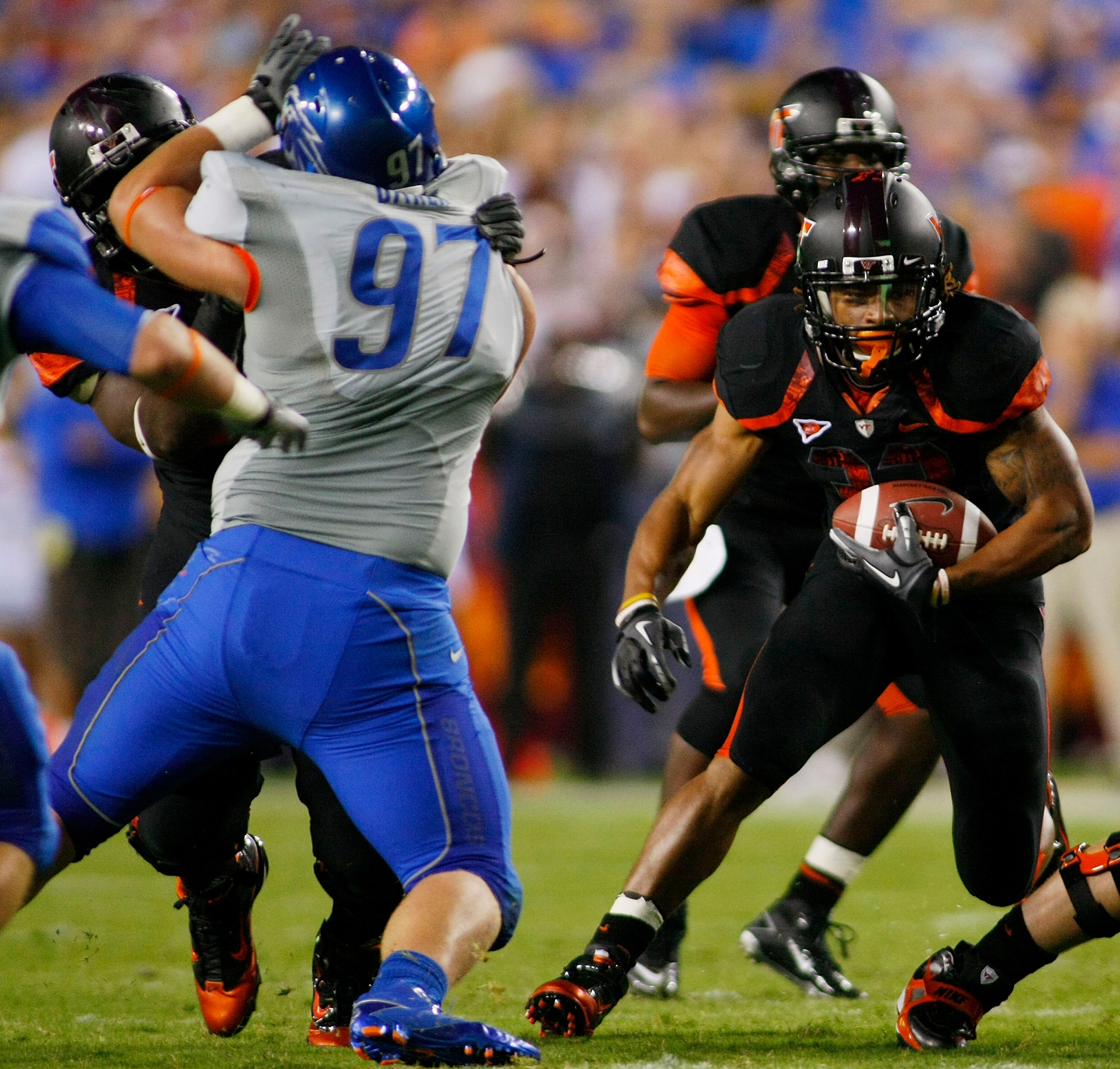 LANDOVER, MD - SEPTEMBER 06: Running back Darren Evans #32 of the Virginia Tech Hokies runs with the ball past defensive end Chase Baker #97 of the Boise State Broncos at FedExField on September 6, 2010 in Landover, Maryland. (Photo by Geoff Burke/Getty LANDOVER, MD - SEPTEMBER 06: Running back Darren Evans #32 of the Virginia Tech Hokies runs with the ball past defensive end Chase Baker #97 of the Boise State Broncos at FedExField on September 6, 2010 in Landover, Maryland. (Photo by Geoff Burke/Getty