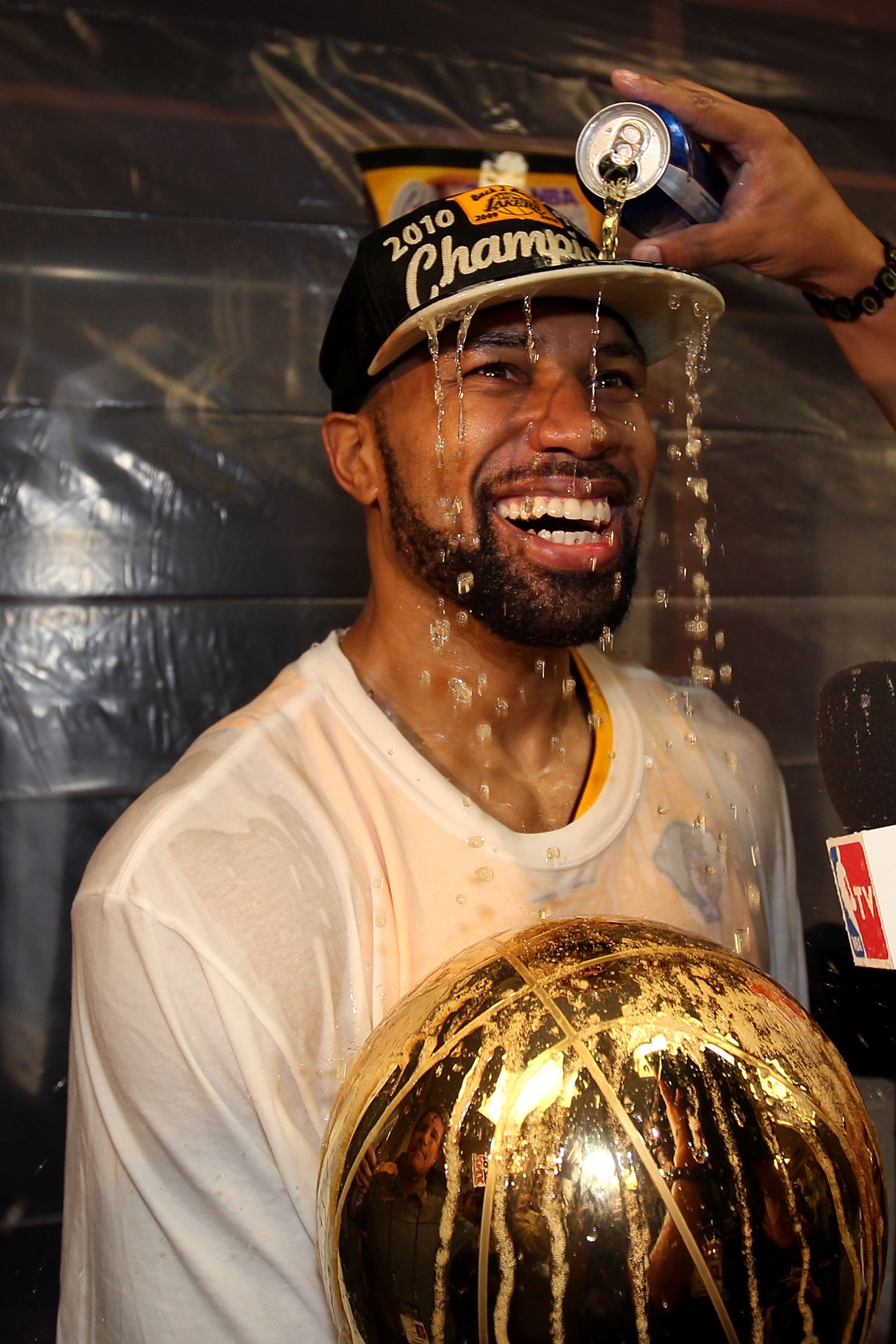 LOS ANGELES, CA - JUNE 17:  Derek Fisher #2 of the Los Angeles Lakers gets a beer poured on him in the locker room after the Lakers defeated the Boston Celtics in Game Seven of the 2010 NBA Finals at Staples Center on June 17, 2010 in Los Angeles, Califor