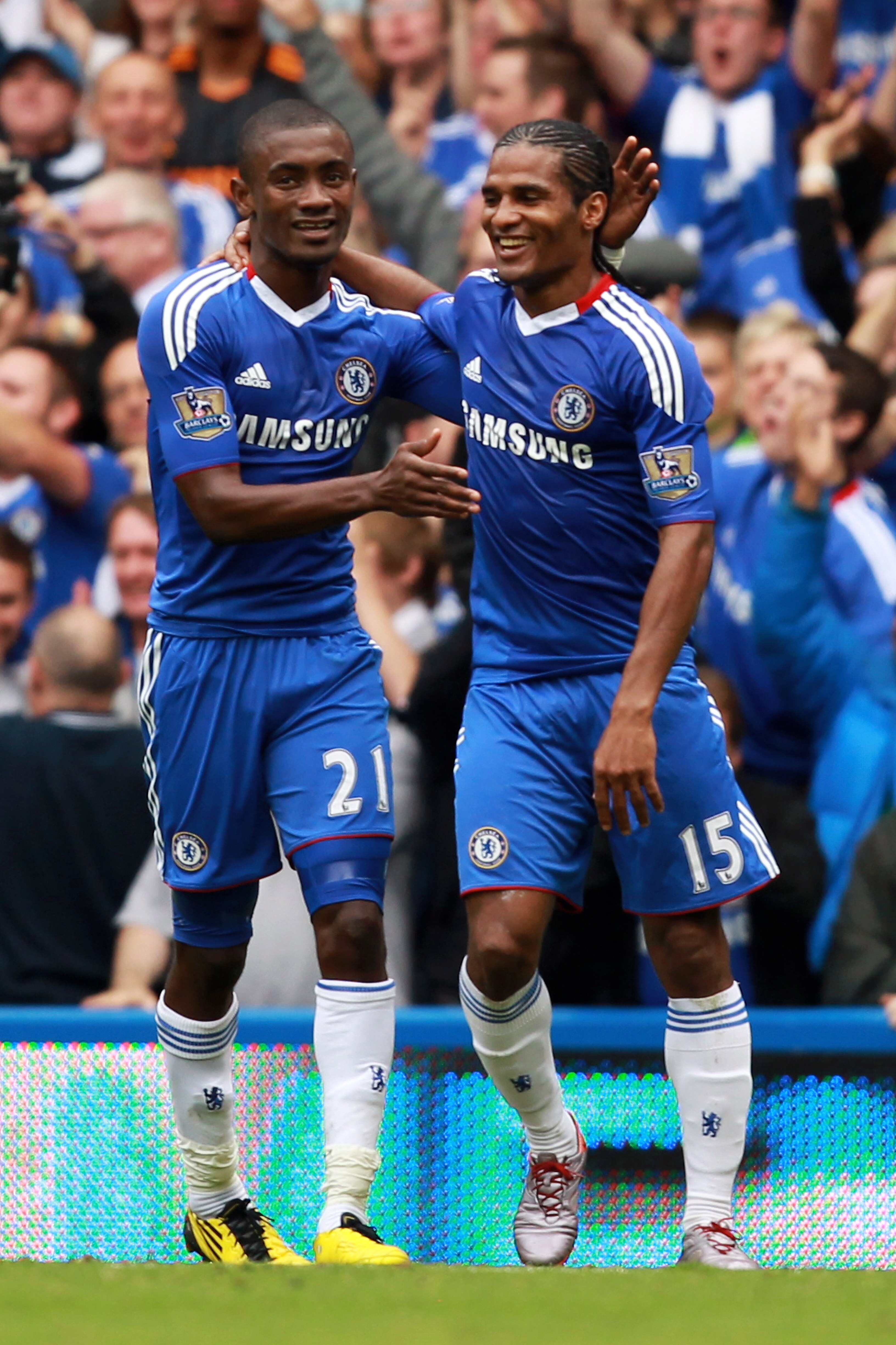 LONDON, ENGLAND - SEPTEMBER 19:  Florent Malouda of Chelsea celebrates with teammate Salomon Kalou (L) after scoring his team's fourth goal during the Barclays Premier League match between Chelsea and Blackpool at Stamford Bridge on September 19, 2010 in