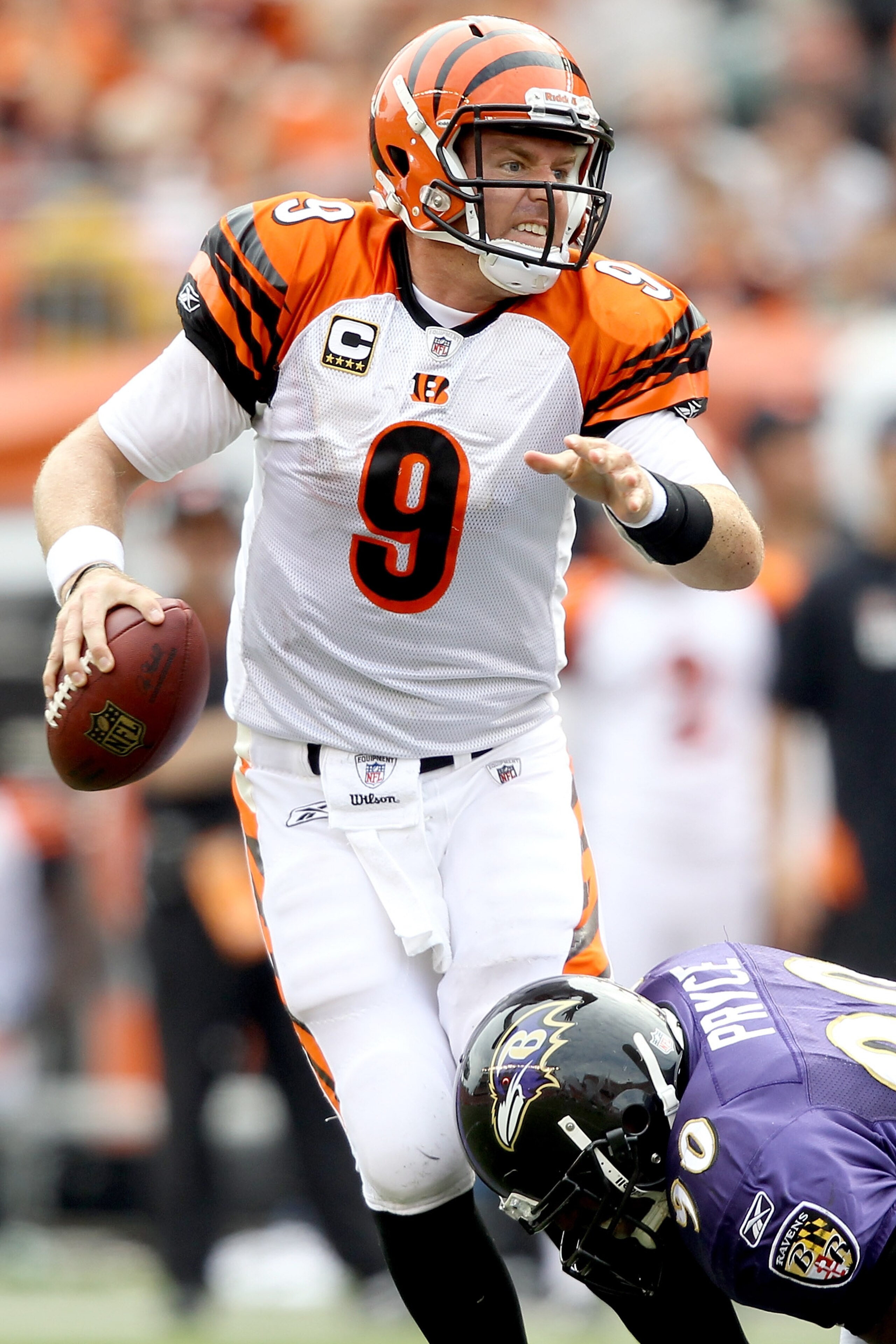 CINCINNATI - SEPTEMBER 19:  Quarterback Carson Palmer #9 of the Cincinnati Bengals tries to break free from Trevor Pryce #90 of the Baltimore Ravens at Paul Brown Stadium on September 19, 2010 in Cincinnati, Ohio.  (Photo by Matthew Stockman/Getty Images)