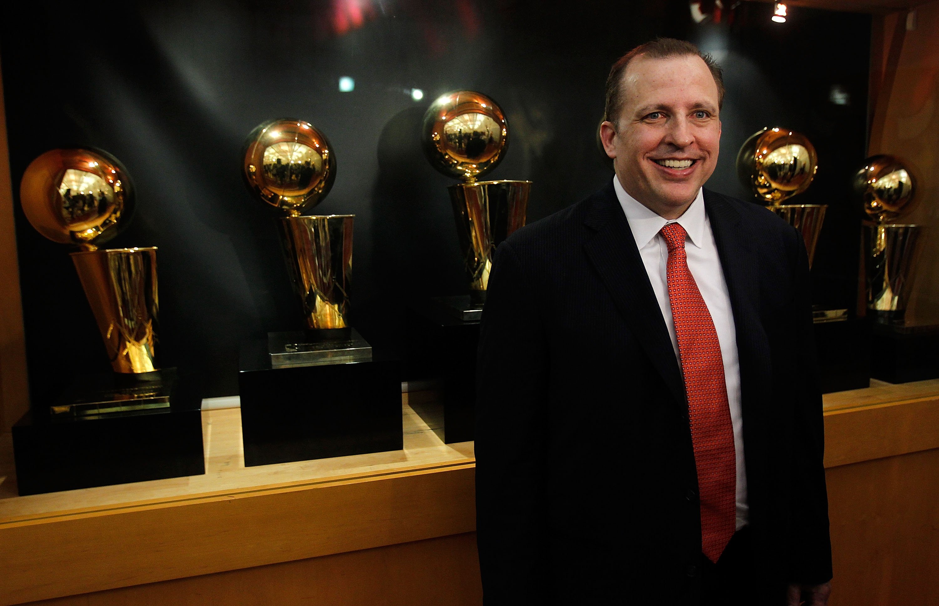 DEERFIELD, IL - JUNE 23: Tom Thibodeau, the new head coach of the Chicago Bulls, poses in front of the Bulls Championship trophies following a press conference at the Berto Center practice facility on June 23, 2010 in Deerfield, Illinois. NOTE TO USER: Us