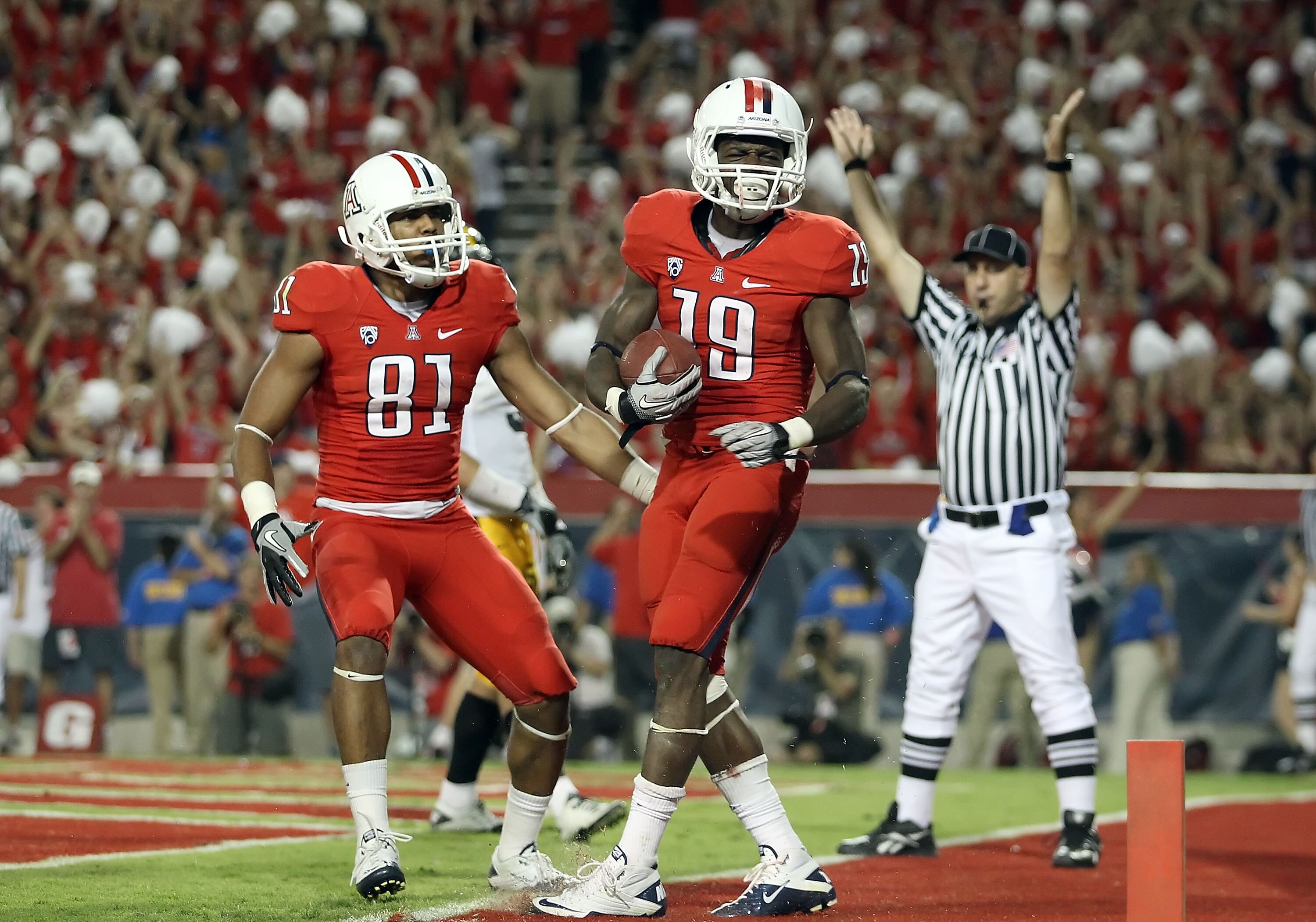 TUCSON, AZ - SEPTEMBER 18:  Wide receiver William Wright #19 of the Arizona Wildcats celebrates after catching a 4 yard touchdown against the Iowa Hawkeyes during the fourth quarter of the college football game at Arizona Stadium on September 18, 2010 in