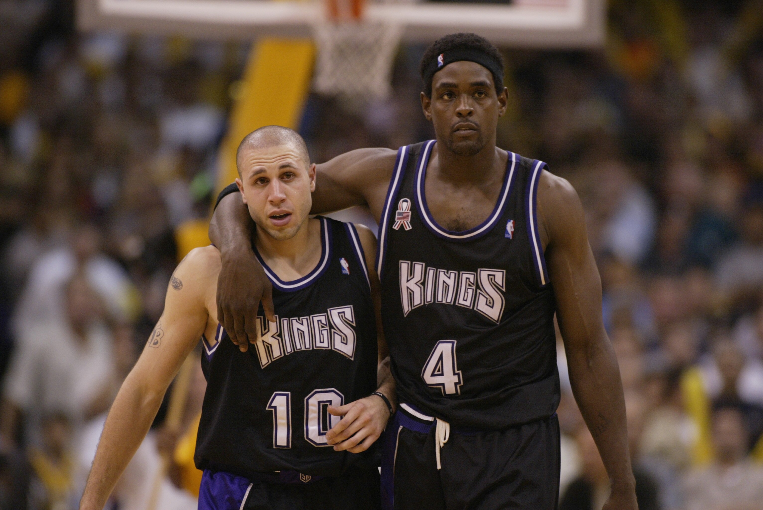 LOS ANGELES - MAY 31:  Chris Webber #4  walks upcourt with Mike Bibby #10 of the Sacramento Kings in Game six of the Western Conference Finals against the Los Angeles Lakers during the 2002 NBA Playoffs on May 31, 2002 at Staples Center in Los Angeles, Ca