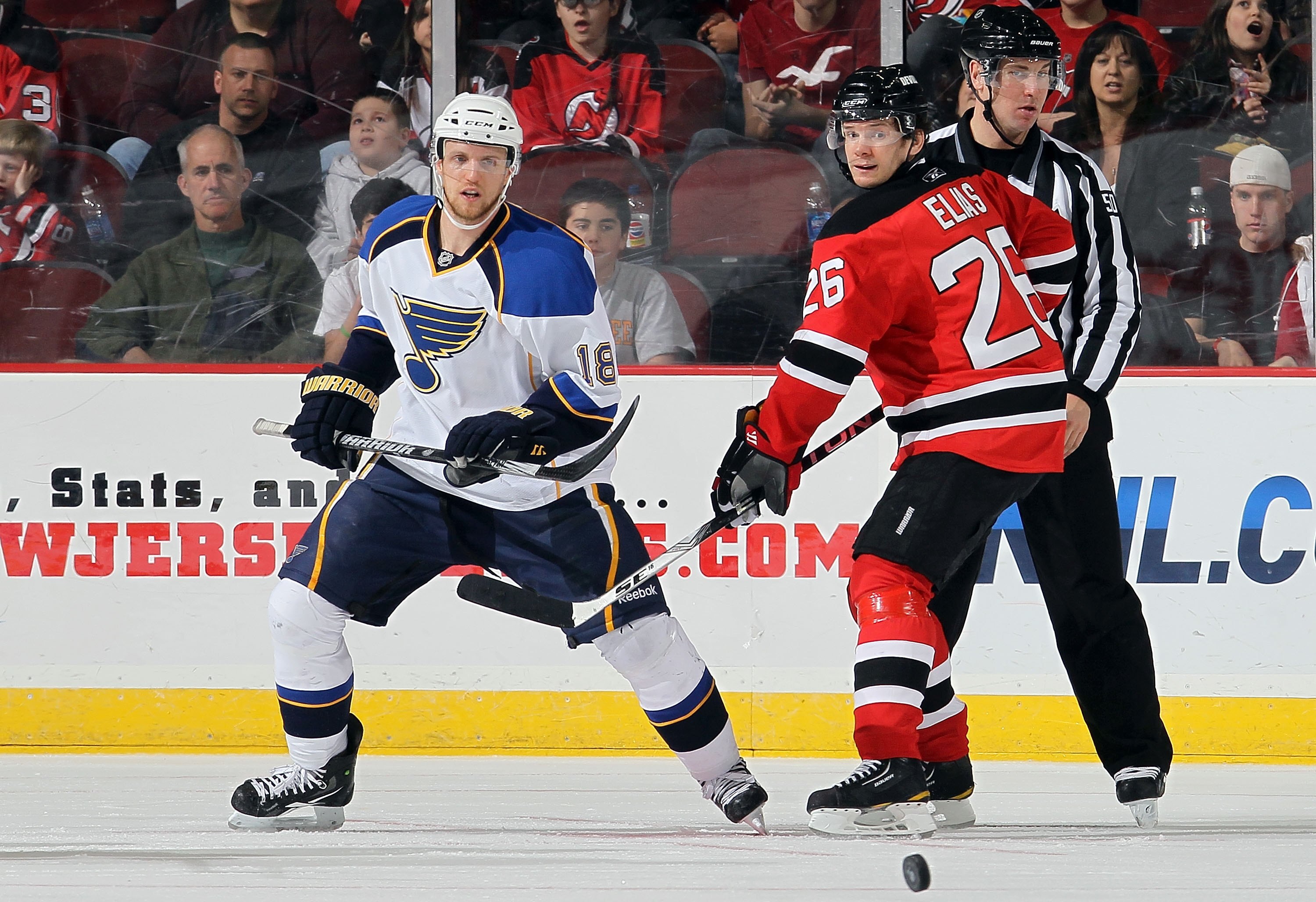 NEWARK, NJ - MARCH 20:  Patrik Elias #26 of the New Jersey Devils skates against Jay McClement #18 of the St. Louis Blues at the Prudential Center on March 20, 2010 in Newark, New Jersey. The Blues defeated the Devils 1-0.  (Photo by Jim McIsaac/Getty Ima