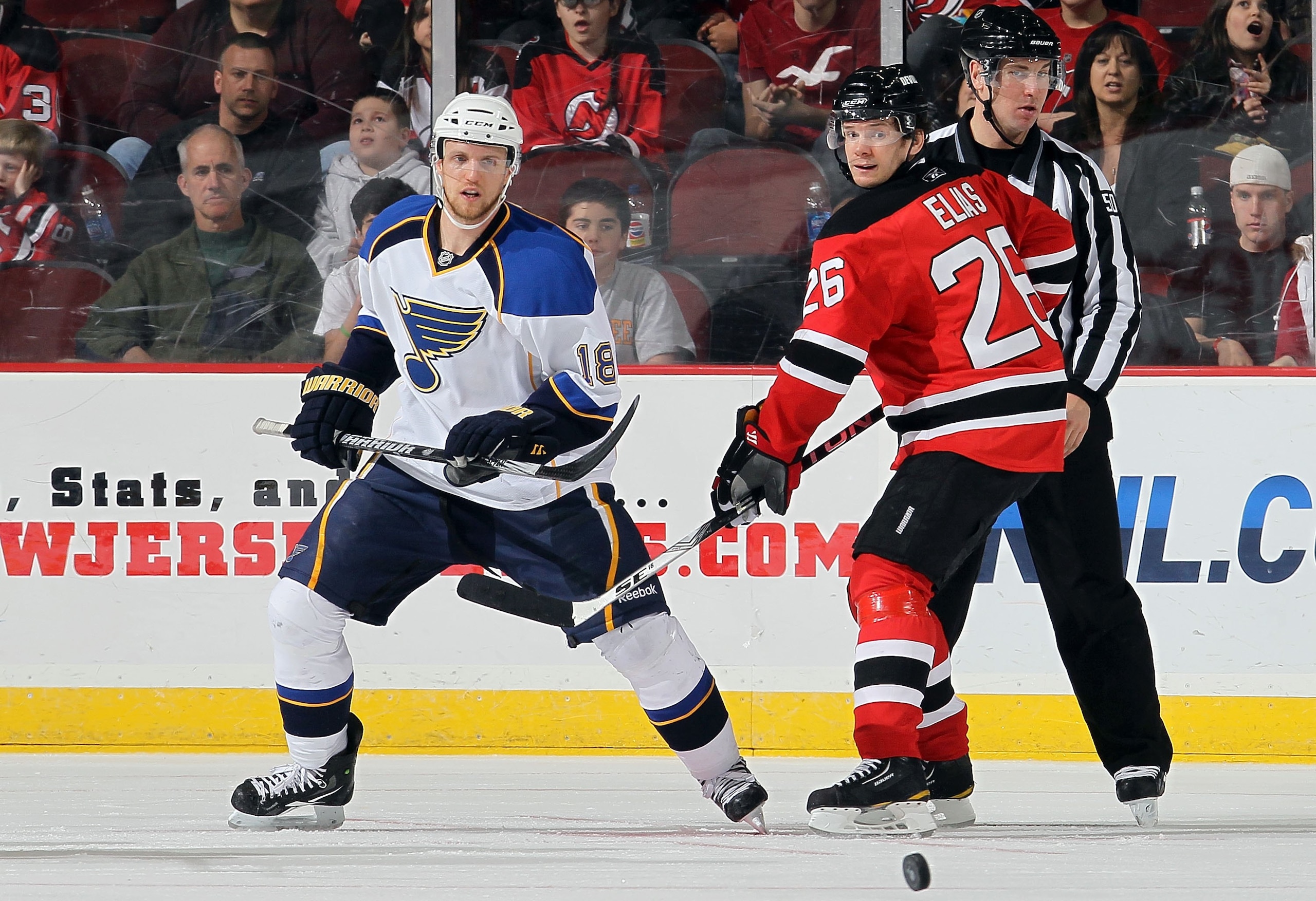 NEWARK, NJ - MARCH 20:  Patrik Elias #26 of the New Jersey Devils skates against Jay McClement #18 of the St. Louis Blues at the Prudential Center on March 20, 2010 in Newark, New Jersey. The Blues defeated the Devils 1-0.  (Photo by Jim McIsaac/Getty Ima