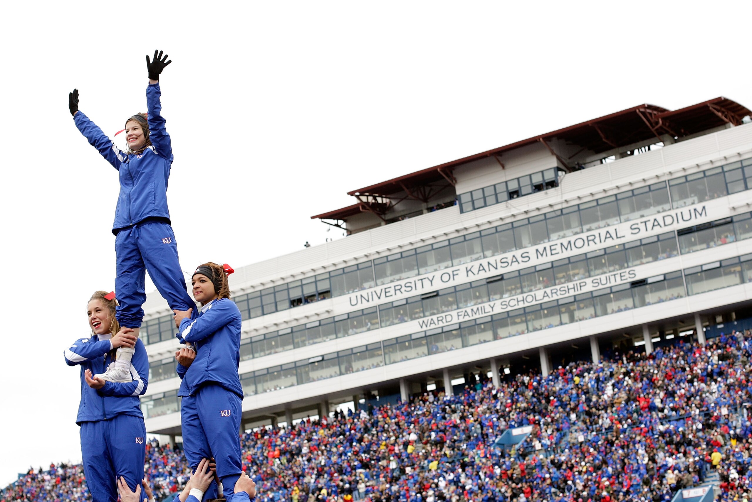 LAWRENCE, KS - OCTOBER 10:  Kansas Jayhawk cheerleaders perform during the game against the Iowa State Cyclones on October 10, 2009 at Memorial Stadium in Lawrence, Kansas.  (Photo by Jamie Squire/Getty Images)