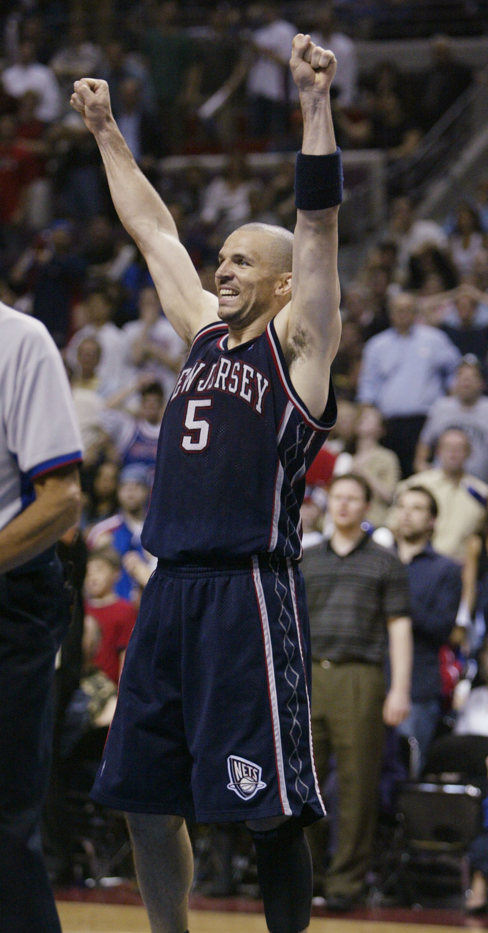 AUBURN HILLS - MAY 14: Jason Kidd #5 of the New Jersey Nets raises his arms in celebration as a foul was called against the Detroit Pistons in Game five of the NBA Eastern Conference Semi-Finals on May 14, 2004 at The Palace of Auburn Hills, Michigan. The