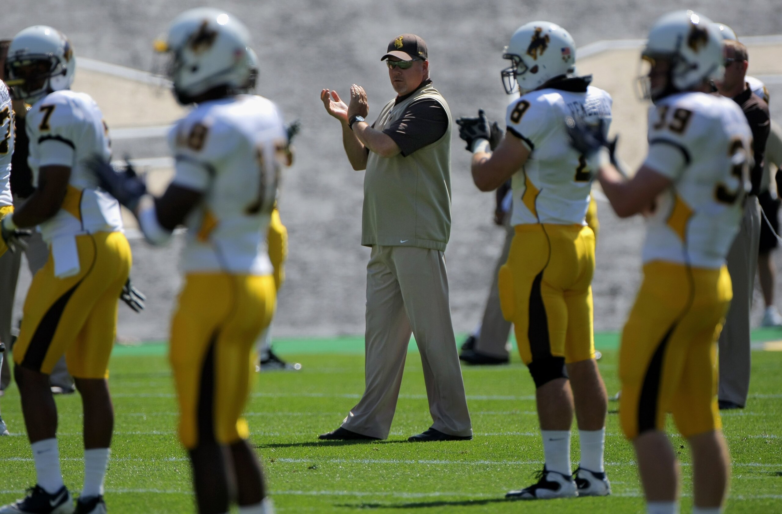 BOULDER, CO - SEPTEMBER 19:  Head coach Dave Christensen of the Wyoming Cowboys prepares to lead his team against the Colorado Buffaloes at Folsom Field on September 19, 2009 in Boulder, Colorado. The Buffaloes defeated the Cowboys 24-0.  (Photo by Doug P