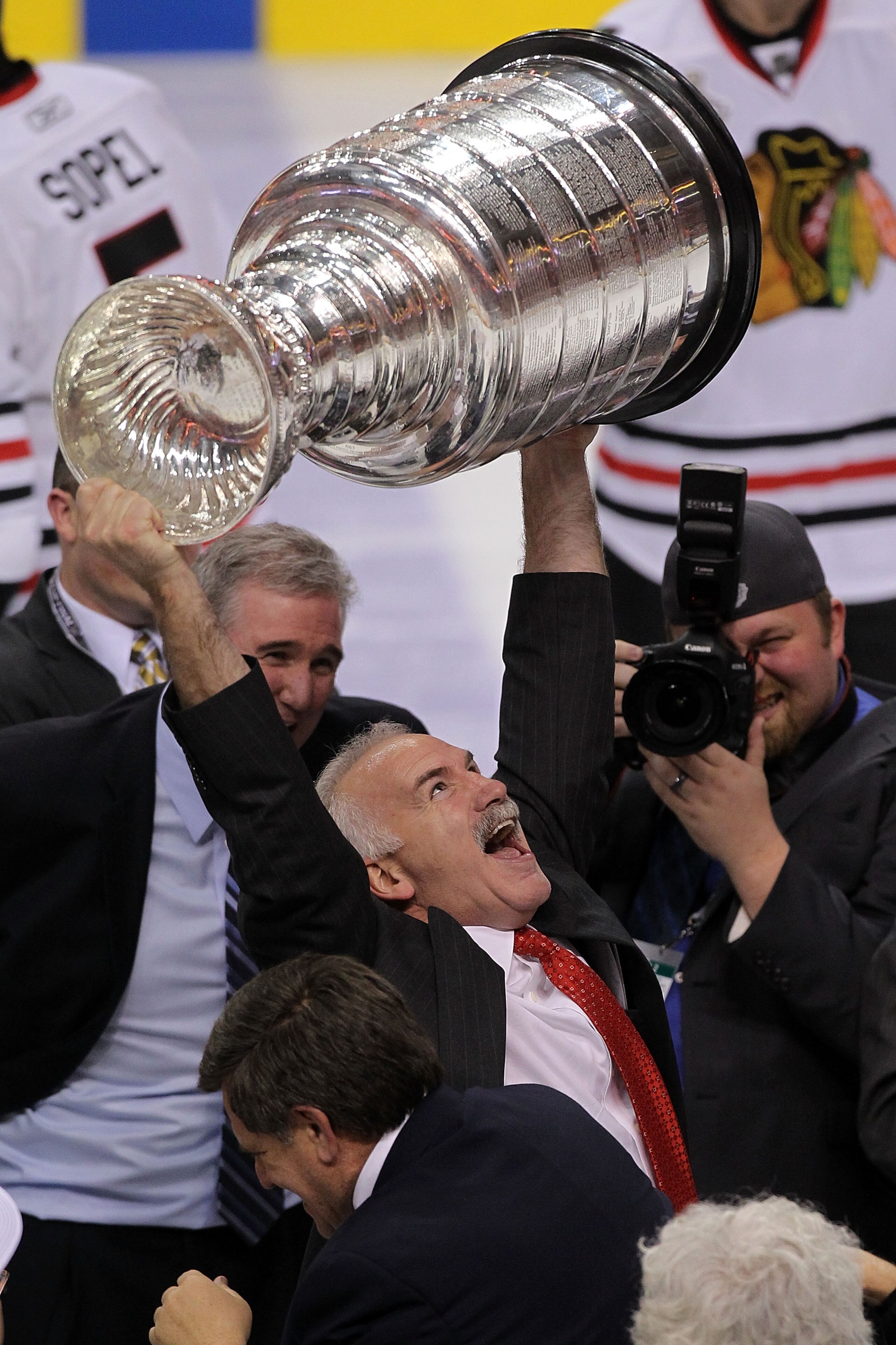 PHILADELPHIA - JUNE 09:  Head coach Joel Quenneville of the Chicago Blackhawks hoists the Stanley Cup after the Blackhawks defeated the Philadelphia Flyers 4-3 in overtime and win the Stanley Cup in Game Six of the 2010 NHL Stanley Cup Final at the Wachov