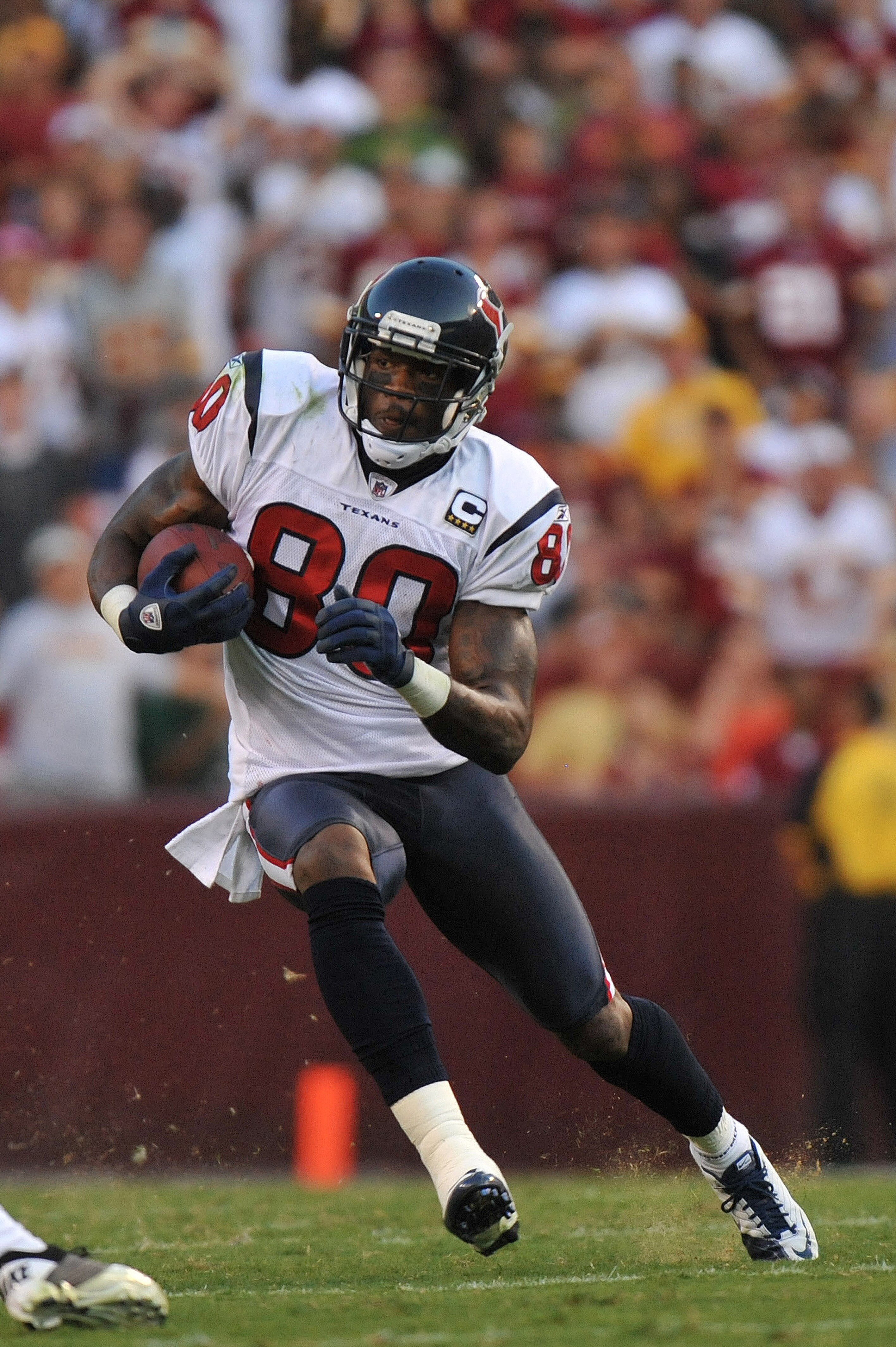 LANDOVER - SEPTEMBER 19:  Andre Johnson #80 of the Houston Texans runs the ball against the Washington Redskins at FedExField on September 19, 2010 in Landover, Maryland. The Texans defeated the Redskins in overtime 30-27. (Photo by Larry French/Getty Ima
