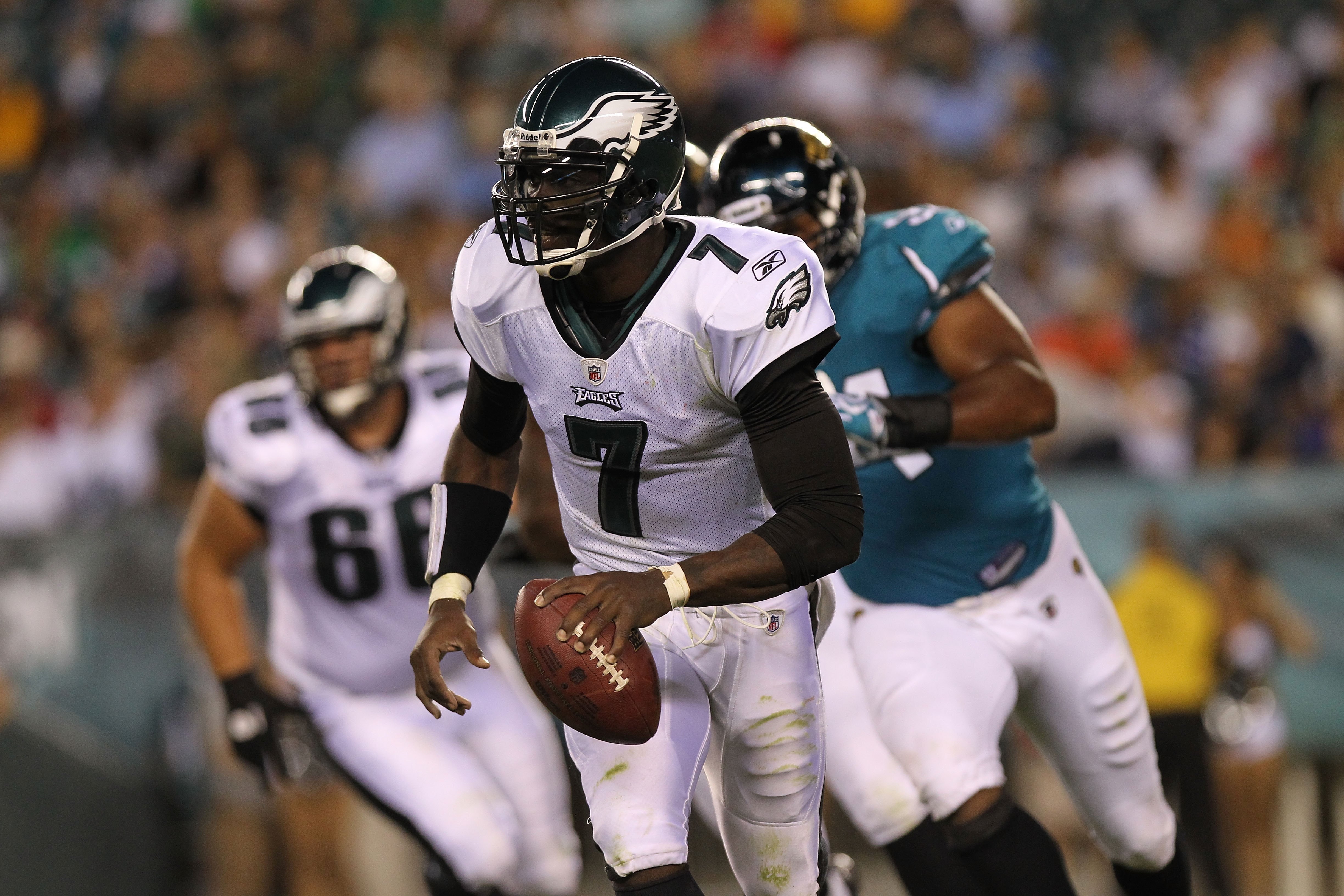 PHILADELPHIA - AUGUST 13:  Michael Vick #7 of the Philadelphia Eagles rolls out to pass against the Jacksonville Jaguars during their preseason game at Lincoln Financial Field on August 13, 2010 in Philadelphia, Pennsylvania.  (Photo by Nick Laham/Getty I
