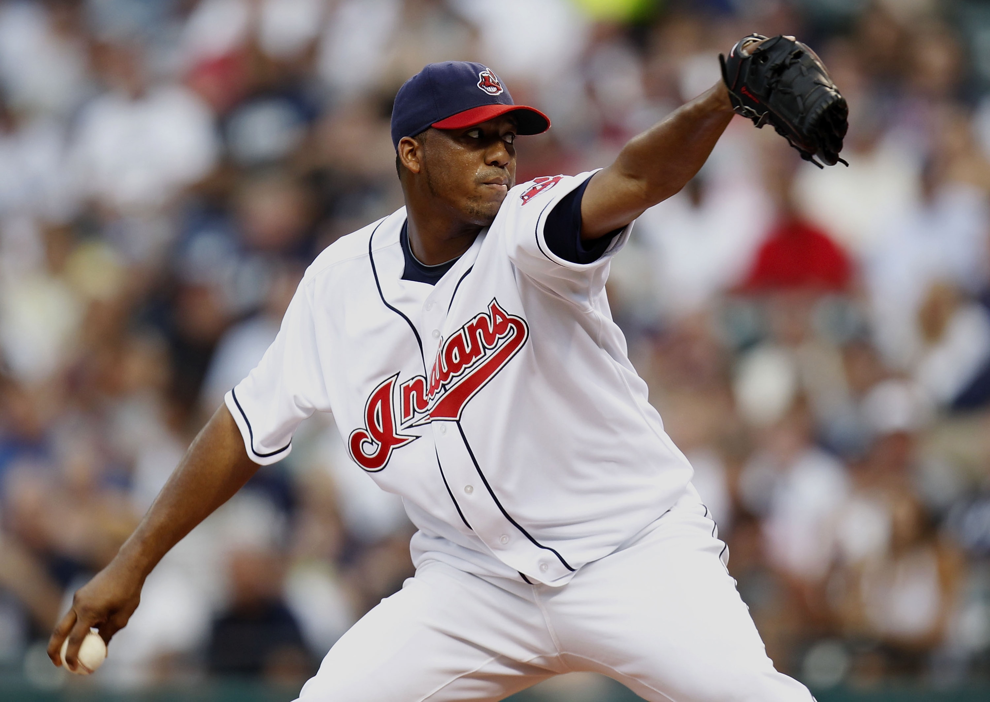 CLEVELAND - JULY 28: Fausto Carmona #55 of the Cleveland Indians throws a first inning pitch while playing the New York Yankees on July 28, 2010 at Progressive Field in Cleveland, Ohio. (Photo by Gregory Shamus/Getty Images) CLEVELAND - JULY 28: Fausto Carmona #55 of the Cleveland Indians throws a first inning pitch while playing the New York Yankees on July 28, 2010 at Progressive Field in Cleveland, Ohio. (Photo by Gregory Shamus/Getty Images)