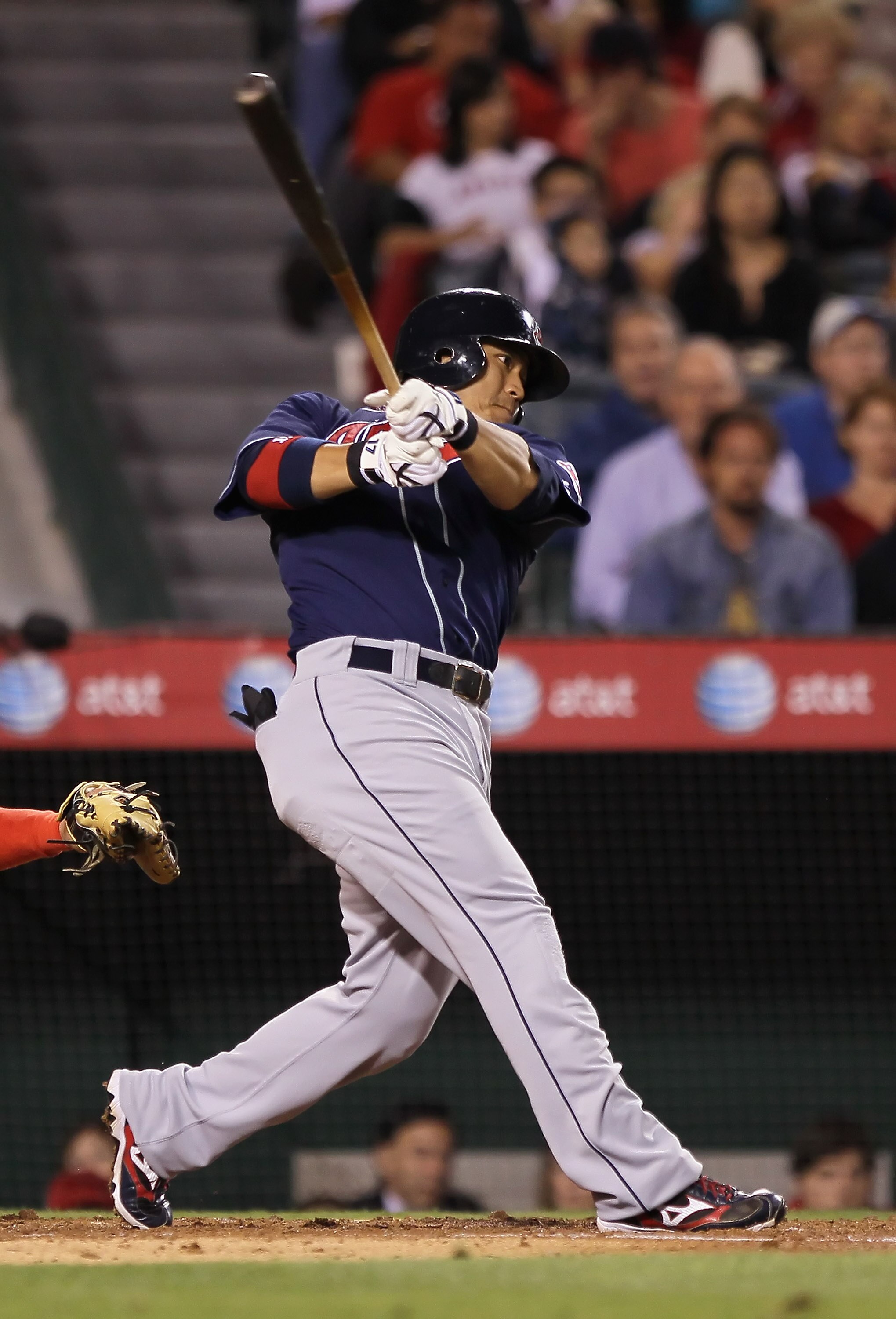 ANAHEIM, CA - SEPTEMBER 07:  Shin-Soo Choo #17 of the Cleveland Indians hits a a sacrifice fly scoring teammate Michael Brantley in the third inning against the Los Angeles Angels of Anaheim at Angel Stadium on September 7, 2010 in Anaheim, California.  (