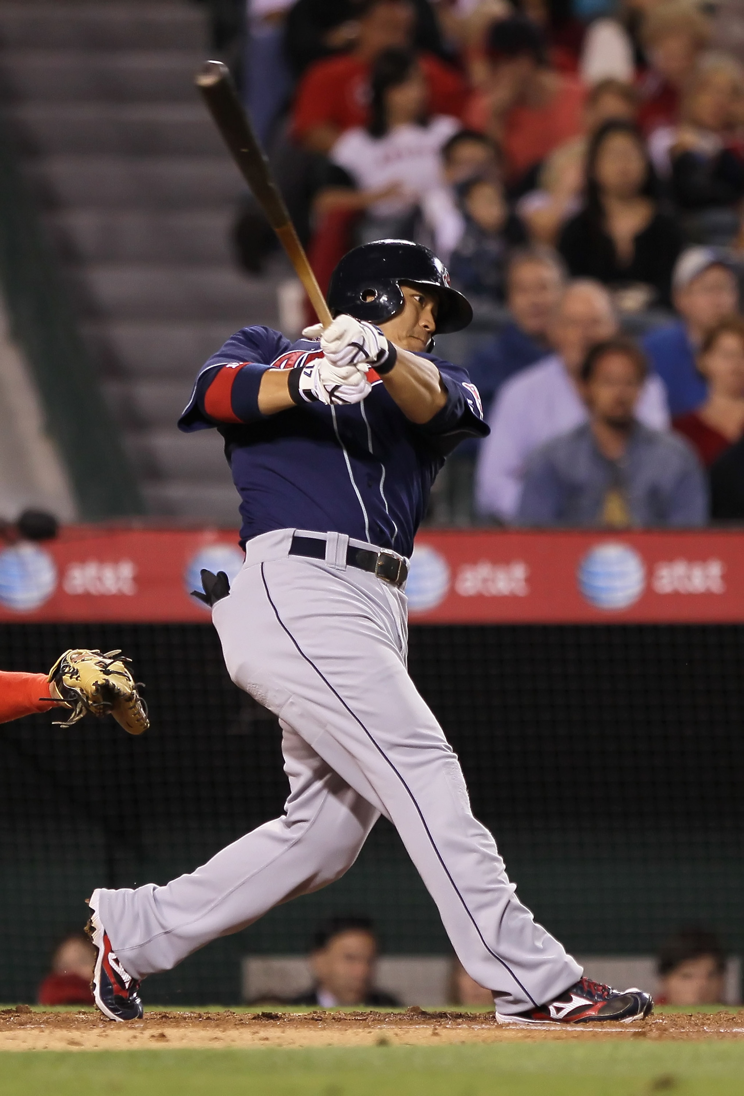 ANAHEIM, CA - SEPTEMBER 07:  Shin-Soo Choo #17 of the Cleveland Indians hits a a sacrifice fly scoring teammate Michael Brantley in the third inning against the Los Angeles Angels of Anaheim at Angel Stadium on September 7, 2010 in Anaheim, California.  (