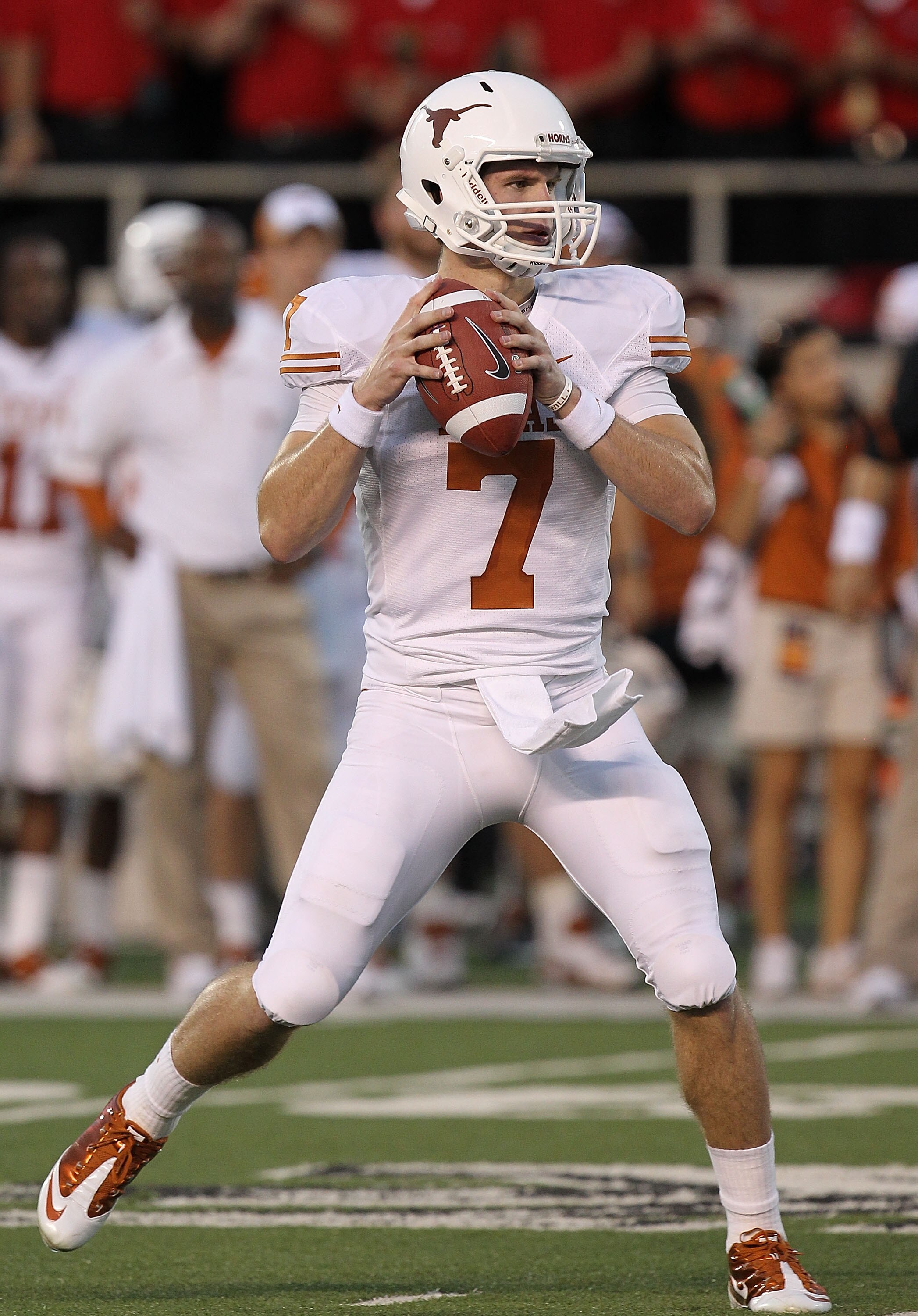 LUBBOCK, TX - SEPTEMBER 18:  Quarterback Garrett Gilbert #7 of the Texas Longhorns looks to pass against the Texas Tech Red Raiders at Jones AT&T Stadium on September 18, 2010 in Lubbock, Texas.  (Photo by Ronald Martinez/Getty Images)