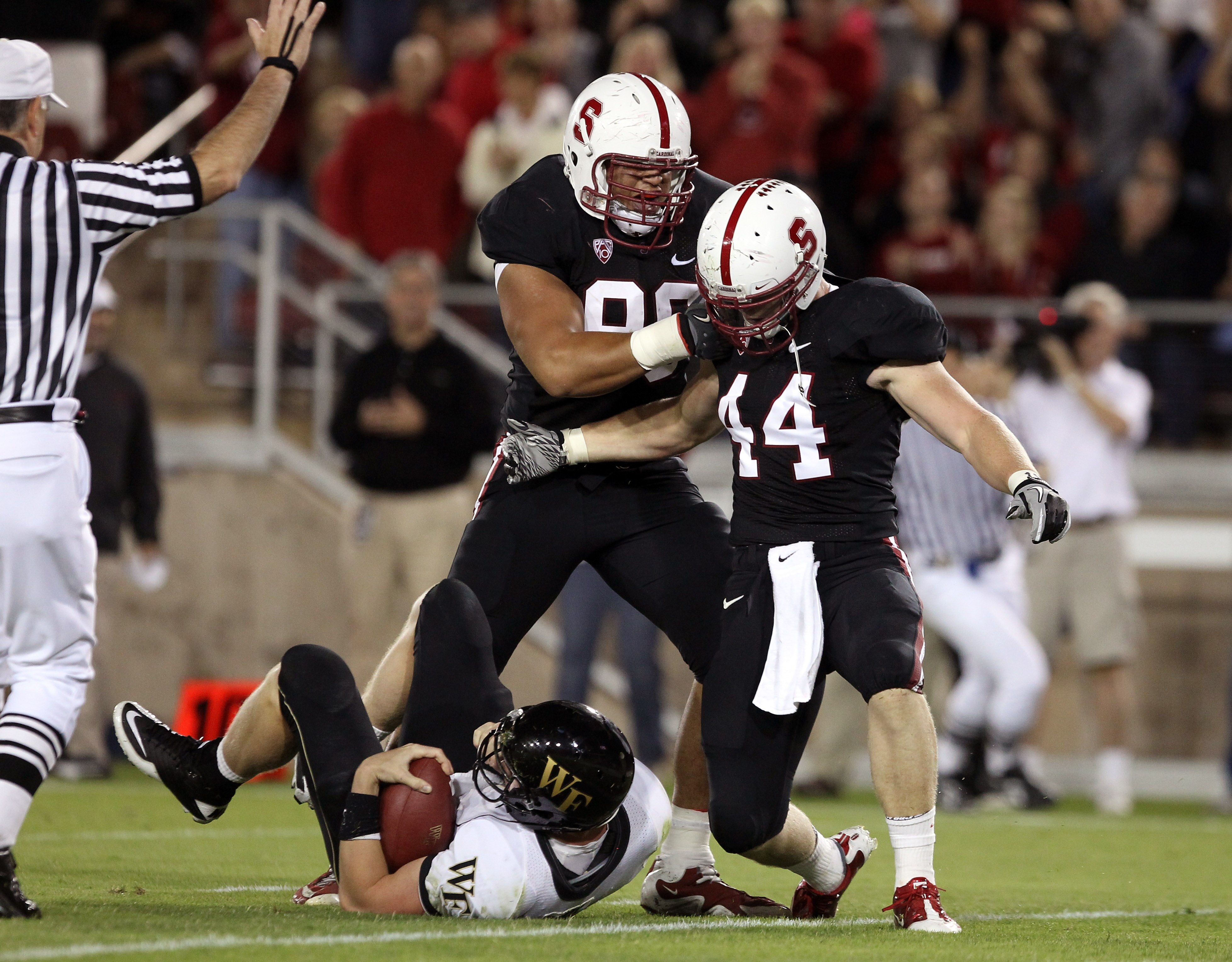 PALO ALTO, CA - SEPTEMBER 18:  Matthew Masifilo #98 and Chase Thomas #44 of the Stanford Cardinal celebrate after Thomas sacked Price Tanner #11 of the Wake Forest Demon Deacons at Stanford Stadium on September 18, 2010 in Palo Alto, California.  (Photo b