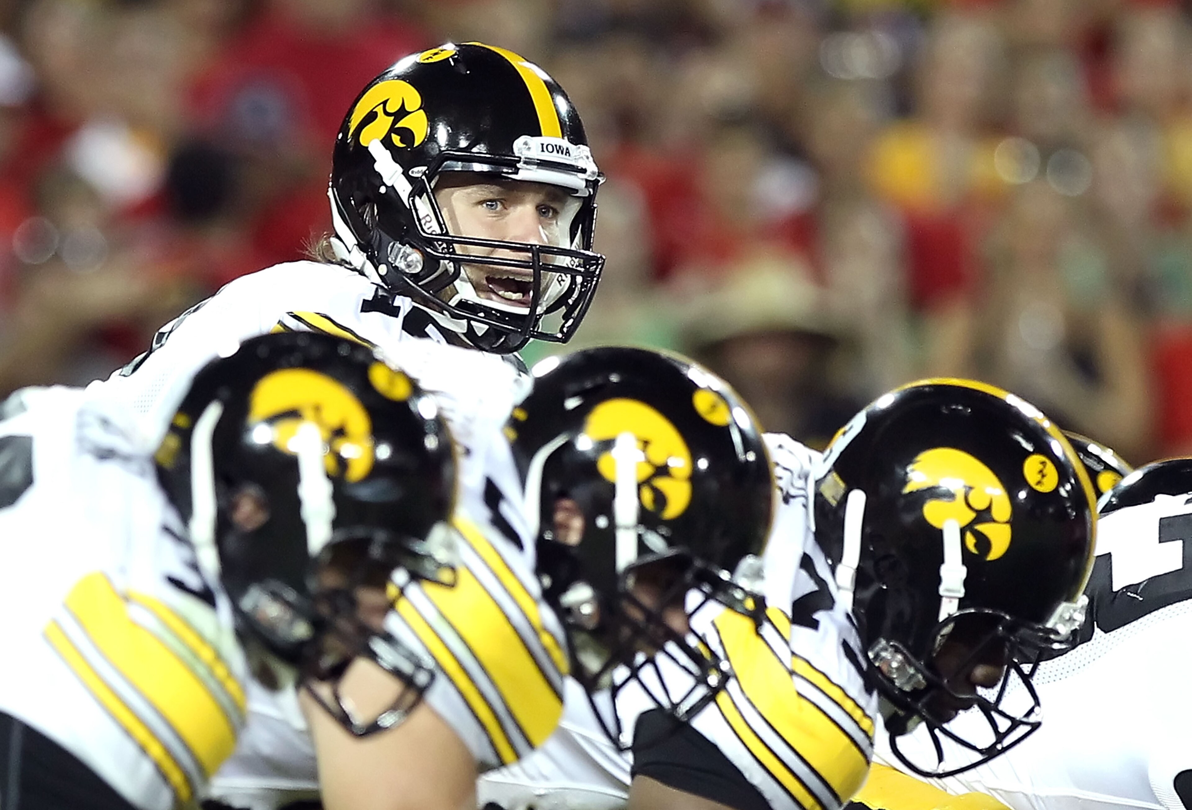 TUCSON, AZ - SEPTEMBER 18:  Quarterback Ricky Stanzi #12 of the Iowa Hawkeyes prepares to snap the ball during the college football game against the Arizona Wildcats at Arizona Stadium on September 18, 2010 in Tucson, Arizona.  The Wildcats defeated the H