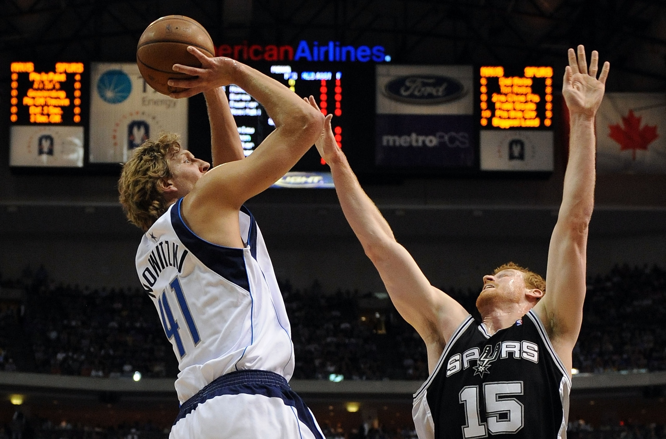 DALLAS - APRIL 23: Forward Dirk Nowitzki #41 of the Dallas Mavericks takes a shot against Matt Bonner #15 of the San Antonio Spurs in Game Three of the Western Conference Quarterfinals during the 2009 NBA Playoffs at American Airlines Center on April 23,
