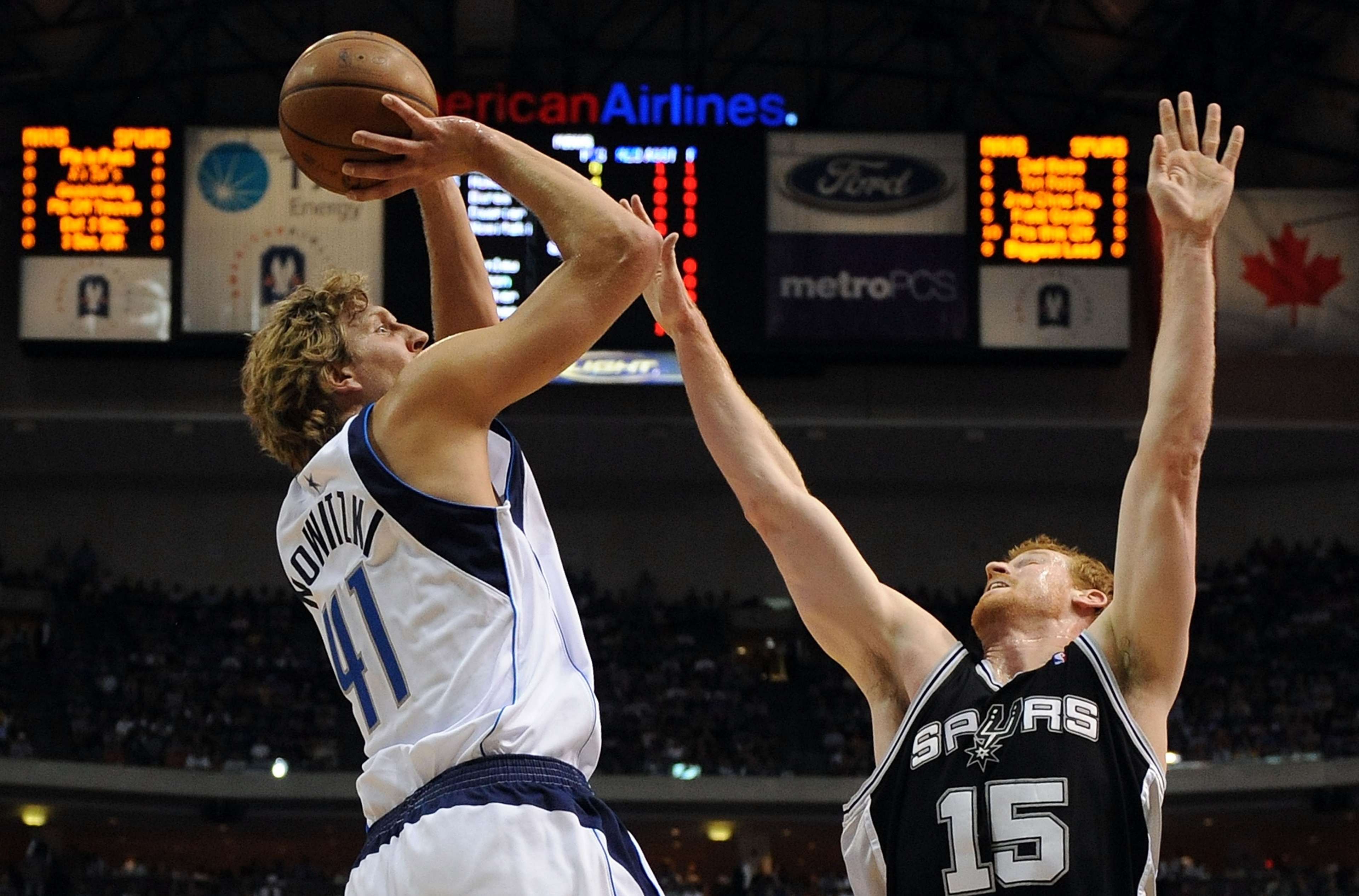 DALLAS - APRIL 23: Forward Dirk Nowitzki #41 of the Dallas Mavericks takes a shot against Matt Bonner #15 of the San Antonio Spurs in Game Three of the Western Conference Quarterfinals during the 2009 NBA Playoffs at American Airlines Center on April 23,
