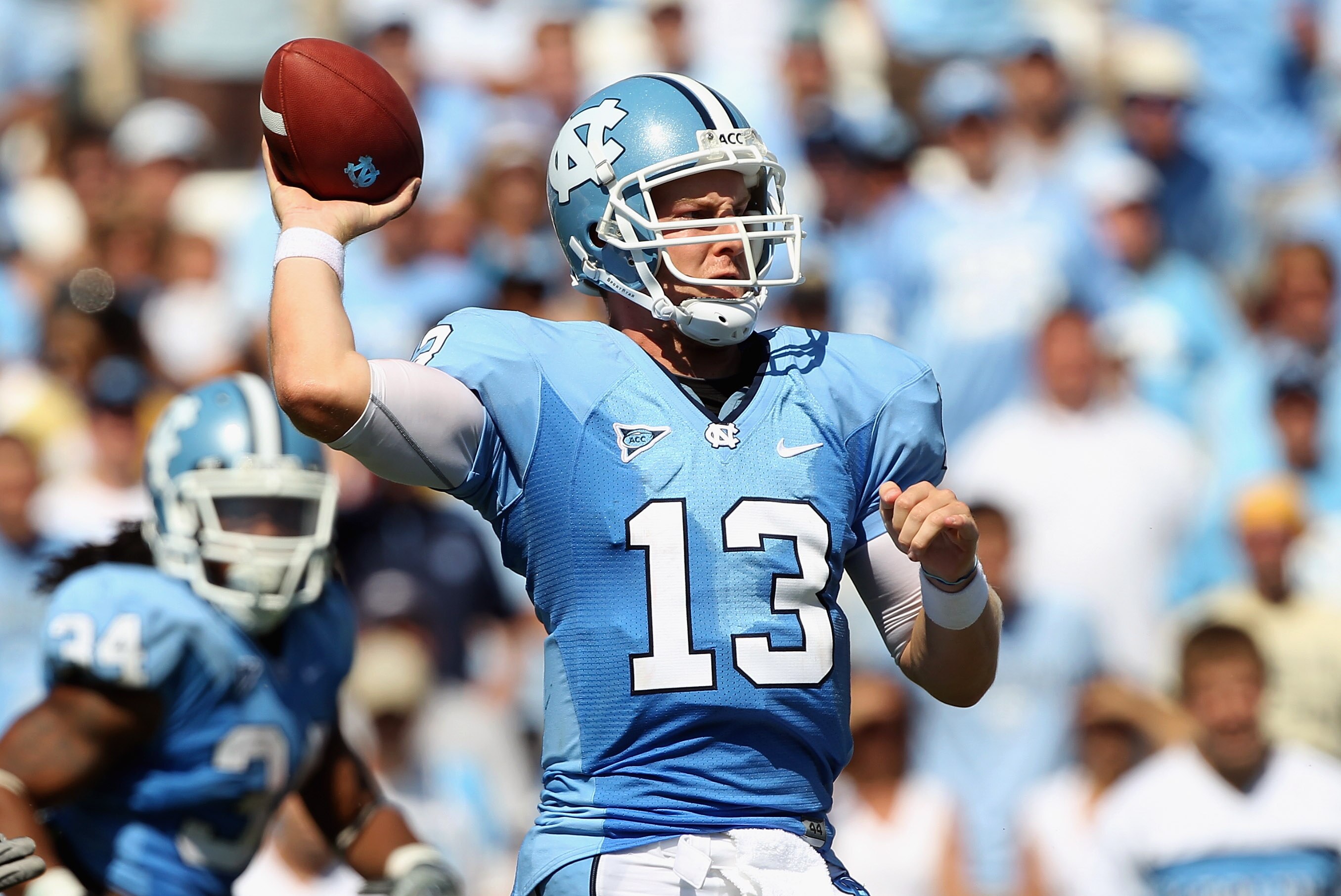 CHAPEL HILL, NC - SEPTEMBER 18: T.J. Yates #13 of the North Carolina Tar Heels drops back to throw a pass against the Georgia Tech Yellow Jackets during their game at Kenan Stadium on September 18, 2010 in Chapel Hill, North Carolina.  (Photo by Streeter