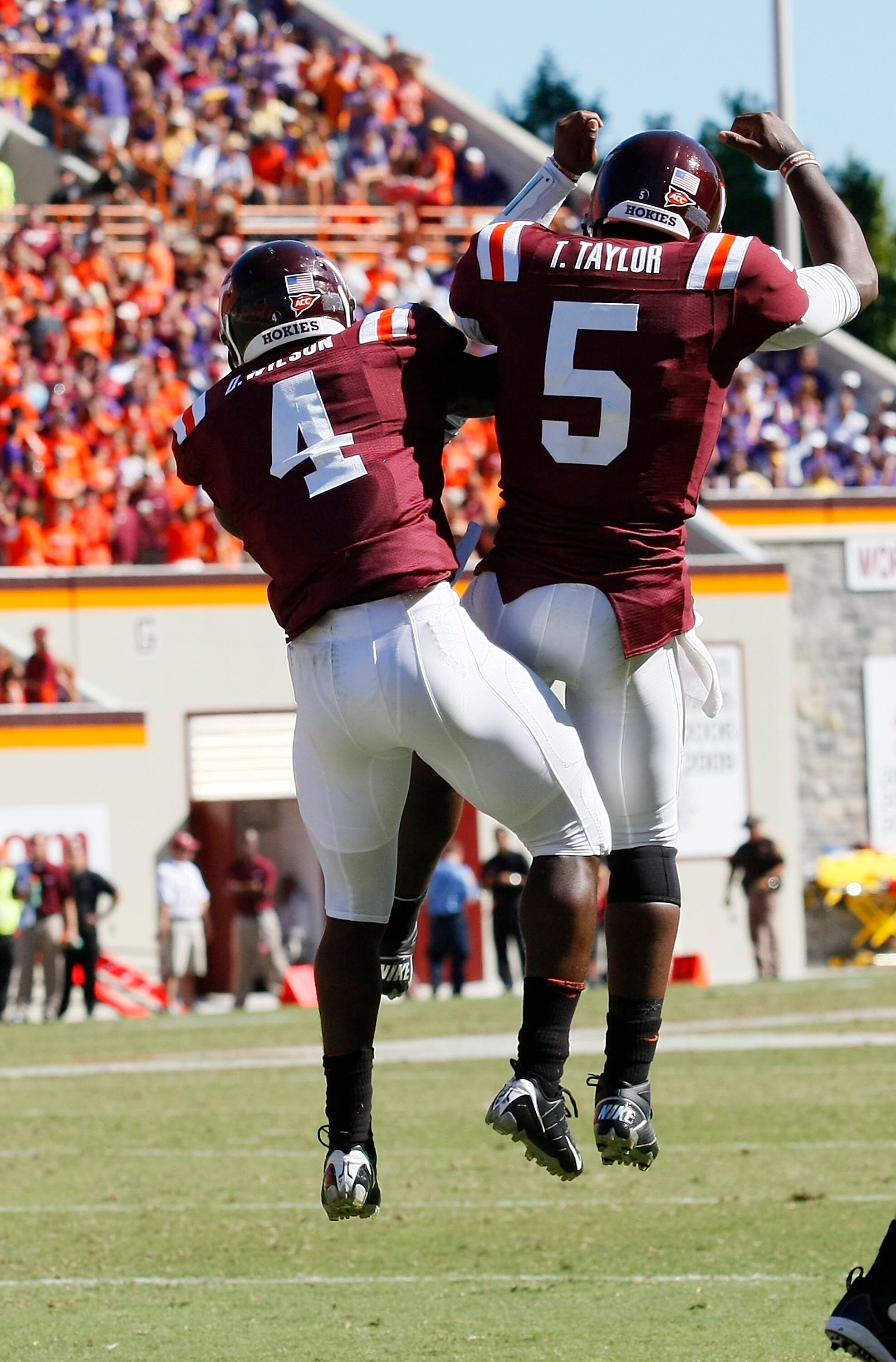 BLACKSBURG, VA - SEPTEMBER 18:  Running back David Wilson #4 and quarterback Tyrod Taylor #5 of the Virgina Tech Hokies celebrate after Wilson scored a touchdown against the East Carolina Pirates at Lane Stadium on September 18, 2010 in Blacksburg, Virgin