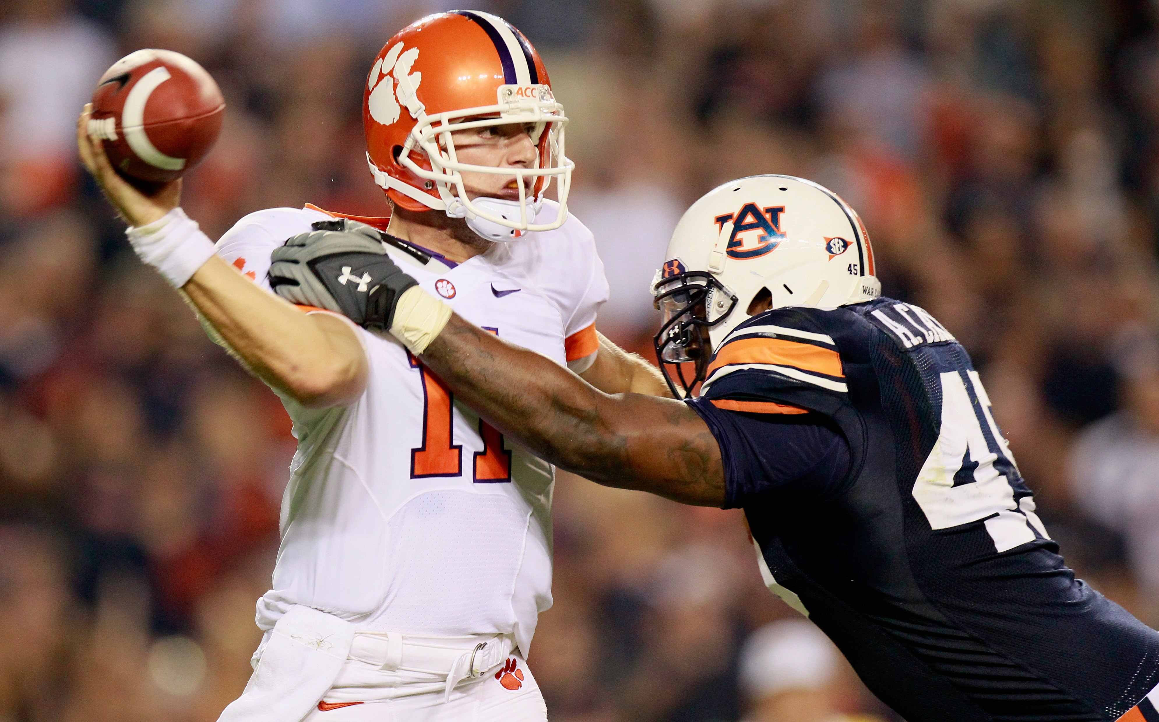 AUBURN, AL - SEPTEMBER 18:  Antoine Carter #45 of the Auburn Tigers pressures quarterback Kyle Parker #11 of the Clemson Tigers at Jordan-Hare Stadium on September 18, 2010 in Auburn, Alabama.  (Photo by Kevin C. Cox/Getty Images)