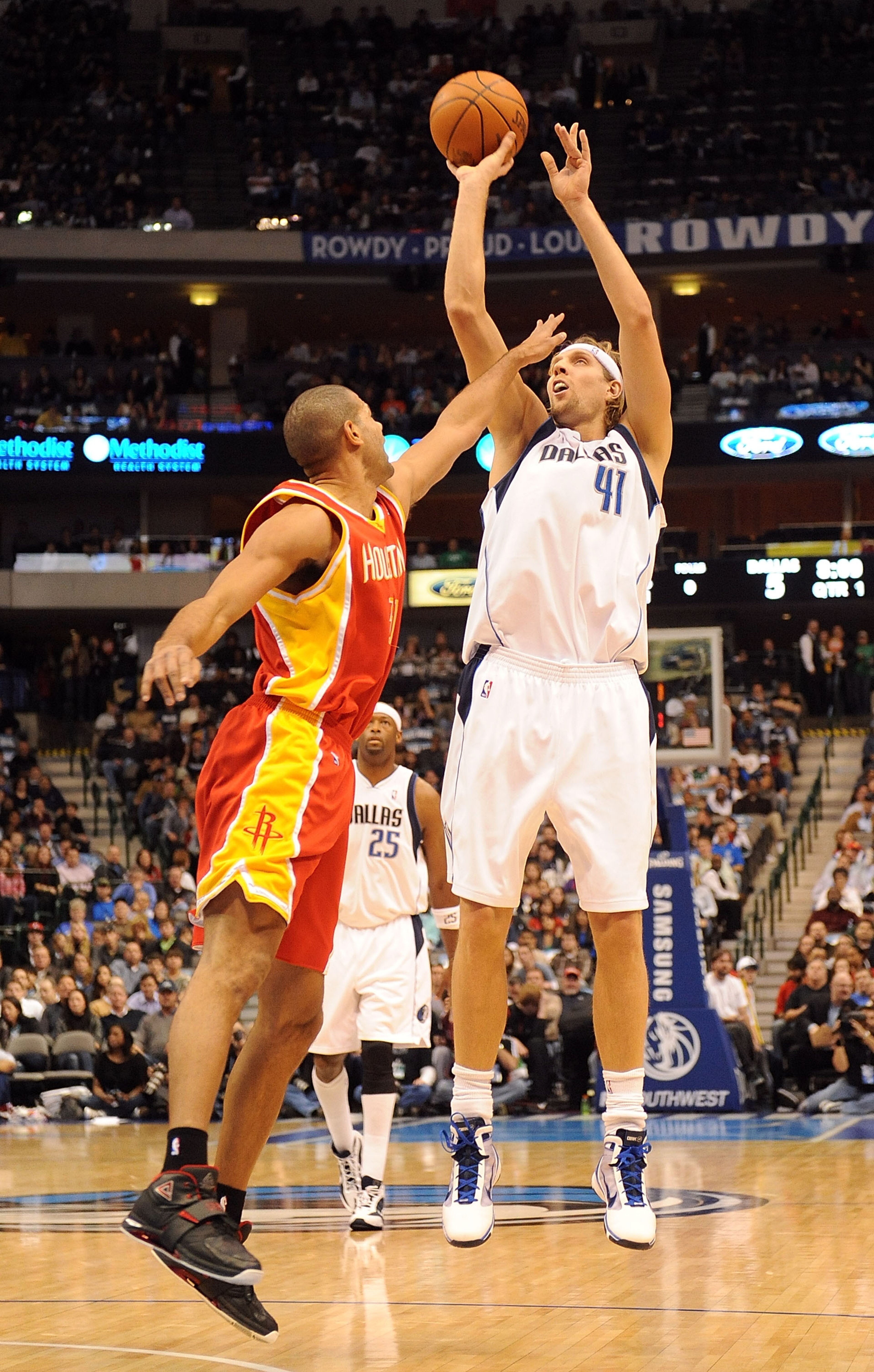 DALLAS - DECEMBER 18:  Forward Dirk Nowitzki #41 of the Dallas Mavericks takes a shot against Shane Battier#31 of the Houston Rockets on December 18, 2009 at American Airlines Center in Dallas, Texas.  NOTE TO USER: User expressly acknowledges and agrees