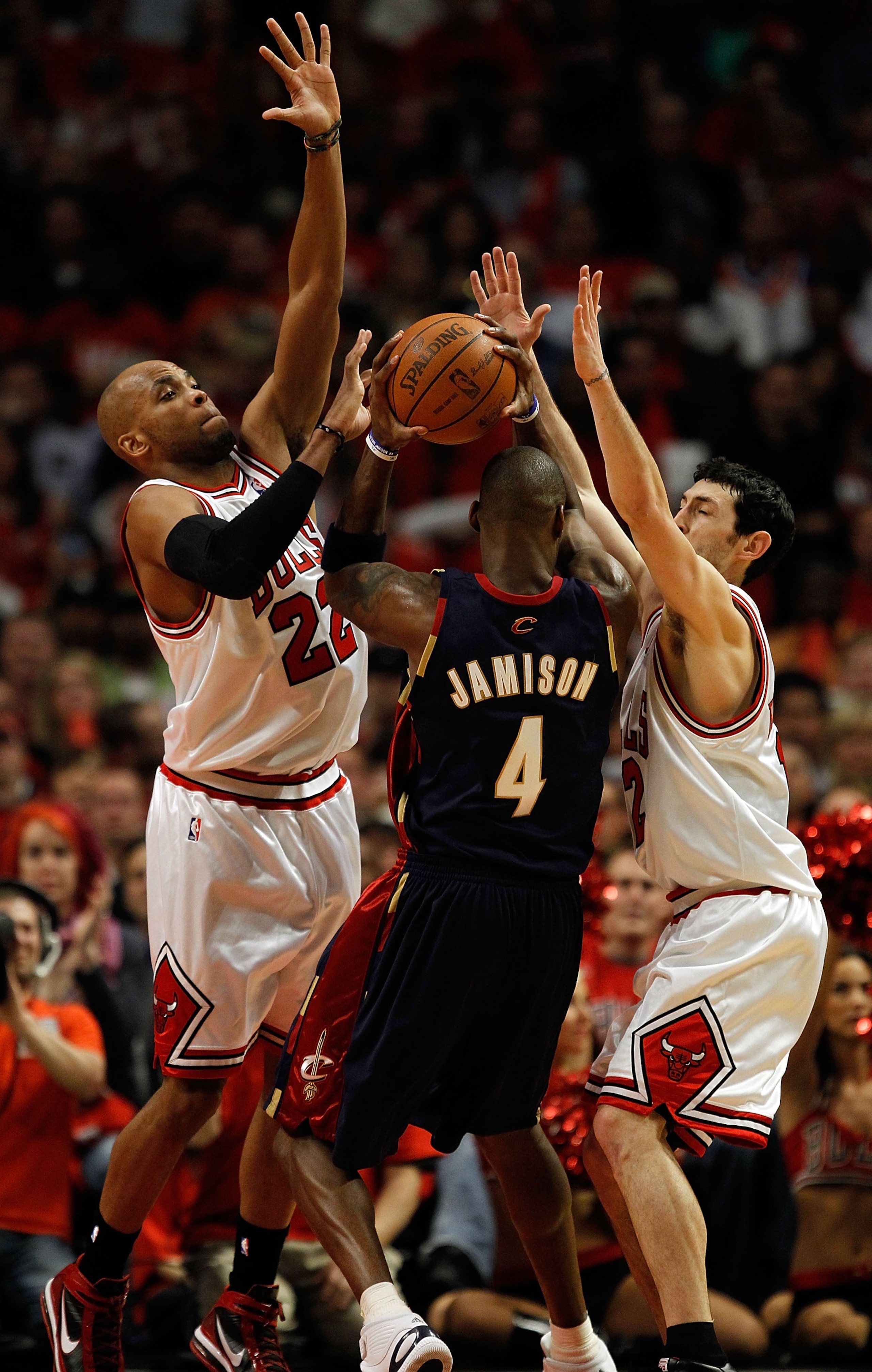 CHICAGO - APRIL 22: Taj Gibson #22 (L) and Kirk Hinrich #12 of the Chicago Bulls defend against Antawn Jamison #4 of the Cleveland Cavaliers in Game Three of the Eastern Conference Quarterfinals during the 2010 NBA Playoffs at the United Center on April 2