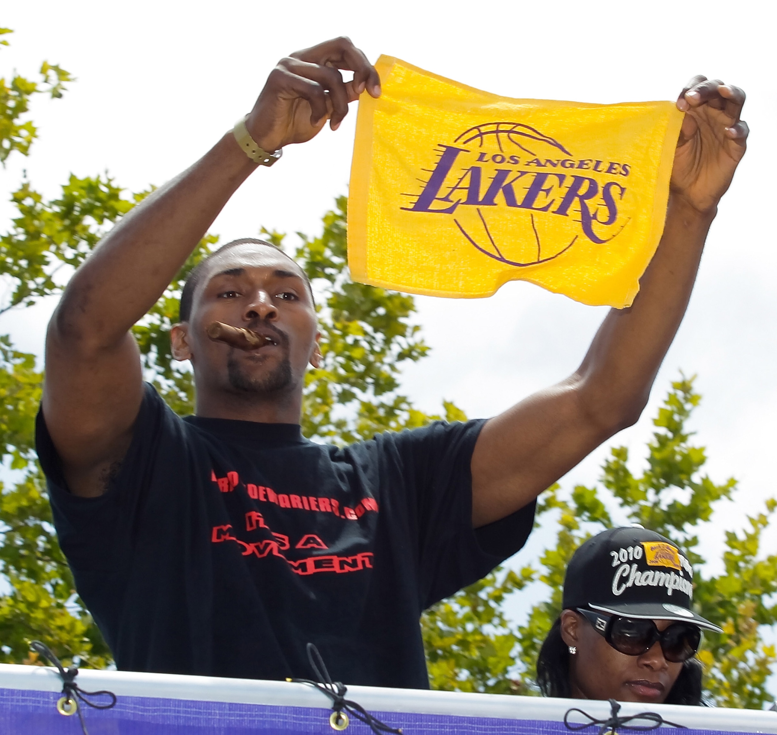 LOS ANGELES, CA - JUNE 21: Los Angeles Lakers small forward Ron Artest salutes the crowd while riding in the victory parade for the the NBA basketball champion team on June 21, 2010 in Los Angeles, California. The Lakers beat the Boston Celtics 87-79 in LOS ANGELES, CA - JUNE 21: Los Angeles Lakers small forward Ron Artest salutes the crowd while riding in the victory parade for the the NBA basketball champion team on June 21, 2010 in Los Angeles, California. The Lakers beat the Boston Celtics 87-79 in