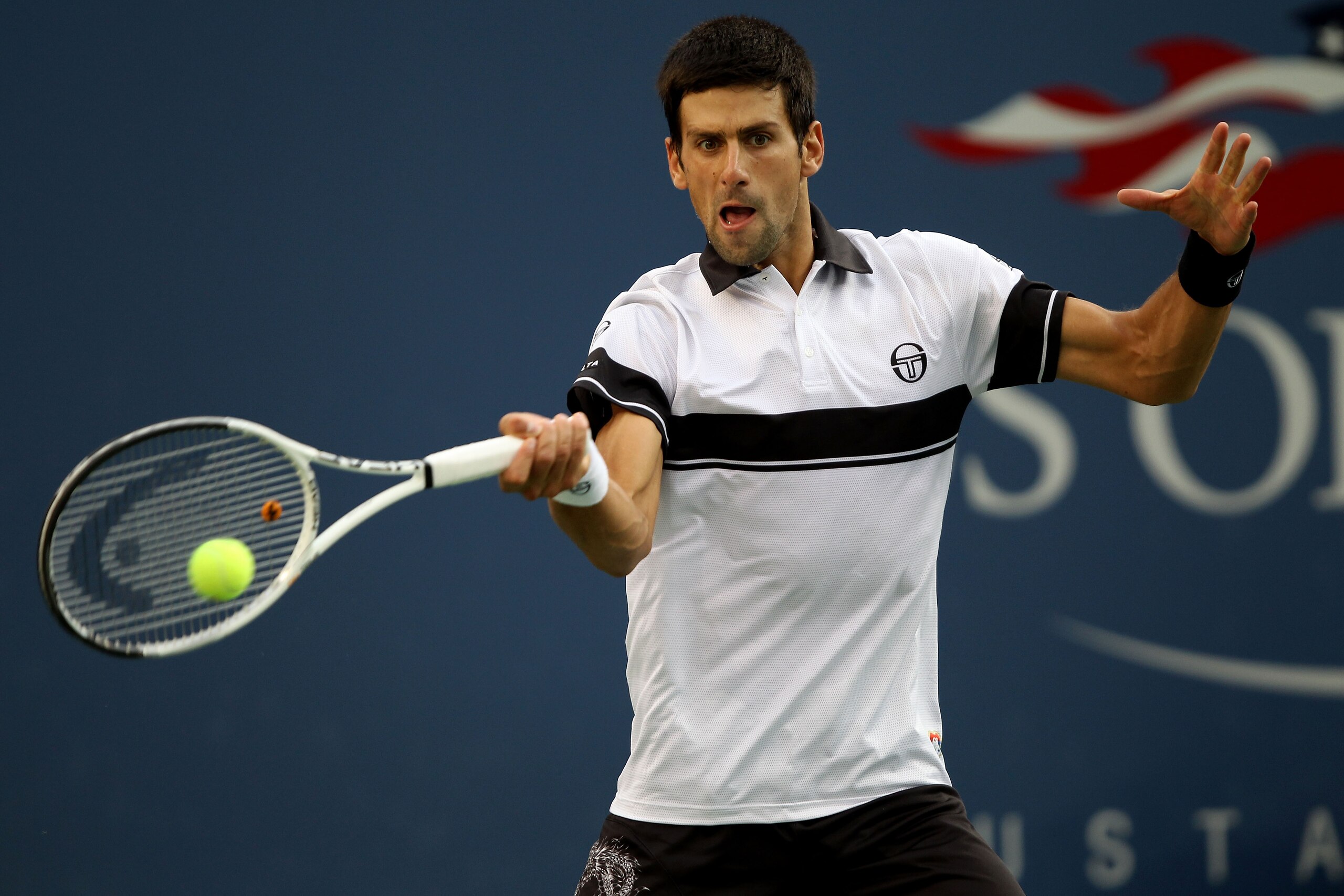 NEW YORK - SEPTEMBER 13:  Novak Djokovic of Serbia returns a shot against Rafael Nadal of Spain during his men's singles final match on day fifteen of the 2010 U.S. Open at the USTA Billie Jean King National Tennis Center on September 13, 2010 in the Flus