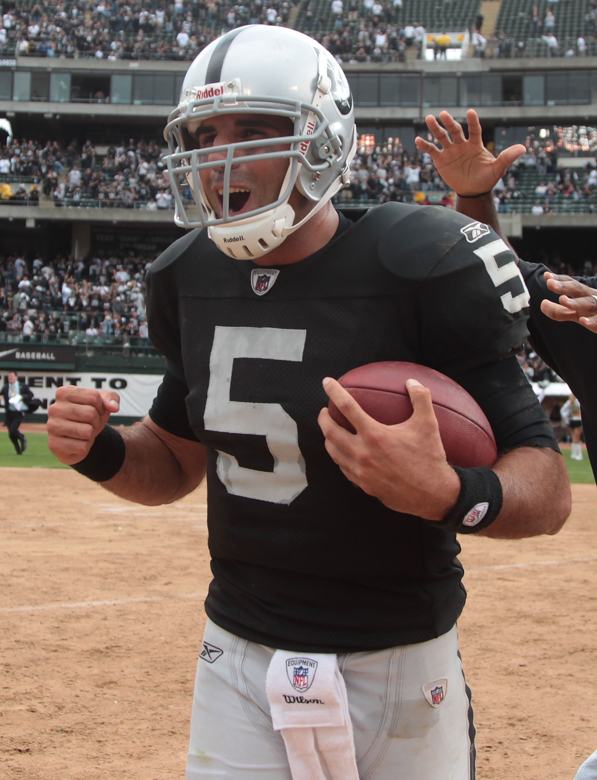 OAKLAND, CA - SEPTEMBER 19:  Bruce Gradkowski #5 of the Oakland Raiders celebrates after defeating the St. Louis Rams during an NFL game at Oakland-Alameda County Coliseum on September 19, 2010 in Oakland, California.  (Photo by Jed Jacobsohn/Getty Images