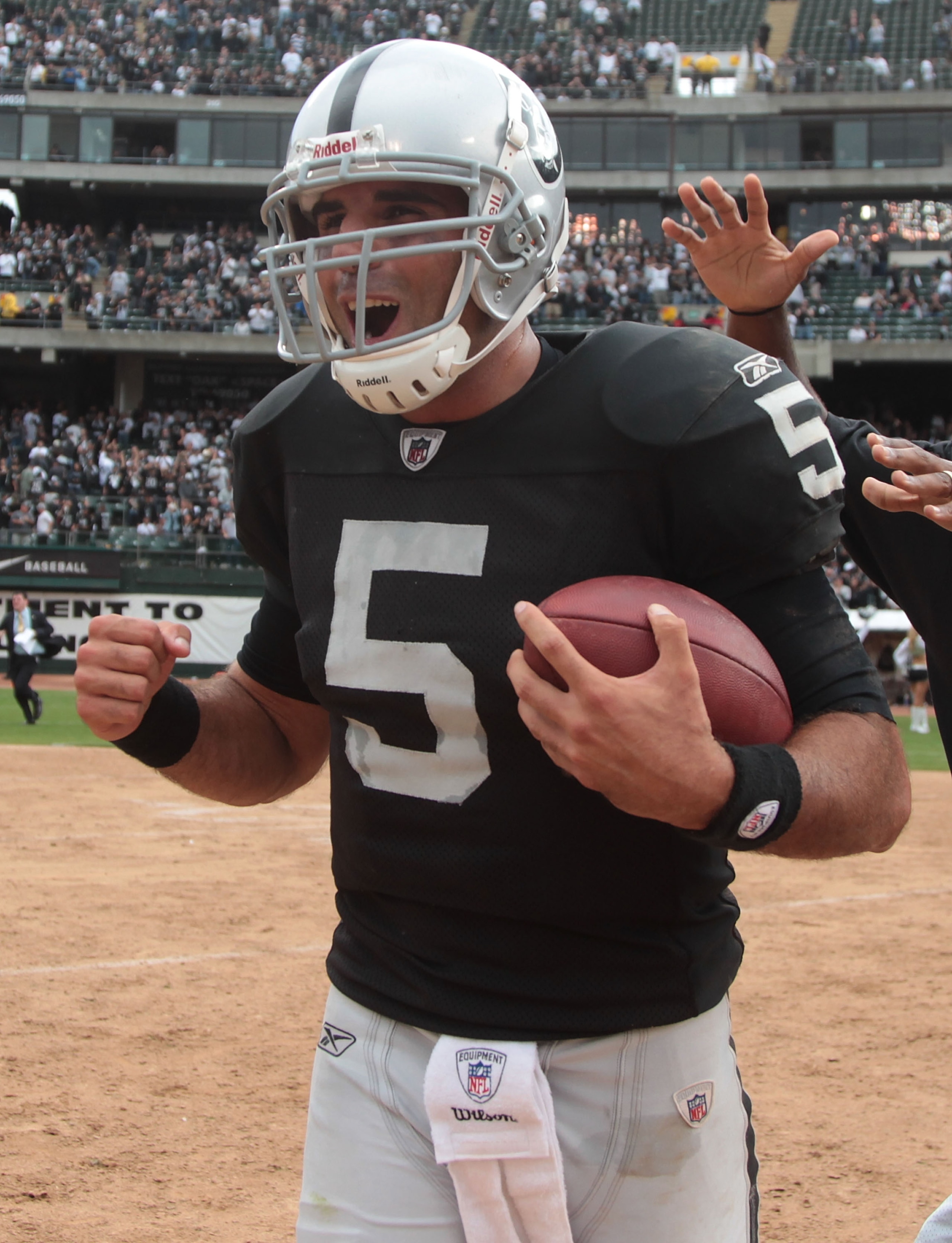 OAKLAND, CA - SEPTEMBER 19:  Bruce Gradkowski #5 of the Oakland Raiders celebrates after defeating the St. Louis Rams during an NFL game at Oakland-Alameda County Coliseum on September 19, 2010 in Oakland, California.  (Photo by Jed Jacobsohn/Getty Images