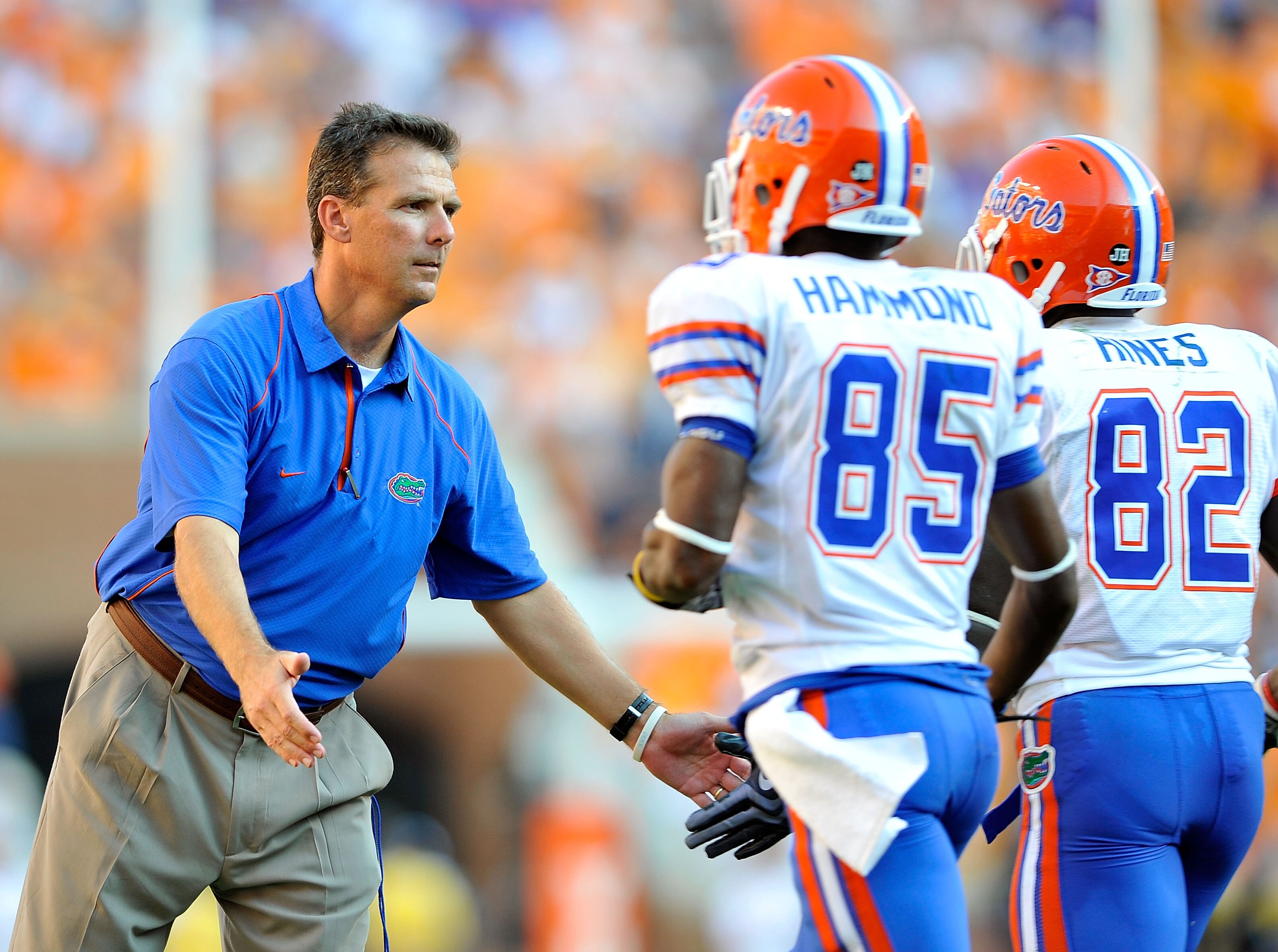 KNOXVILLE, TN - SEPTEMBER 18:  Coach Urban Meyer of the Florida Gators congratulates his players after scoring a touchdown against the Tennessee Volunteers at Neyland Stadium on September 18, 2010 in Knoxville, Tennessee.  (Photo by Grant Halverson/Getty 