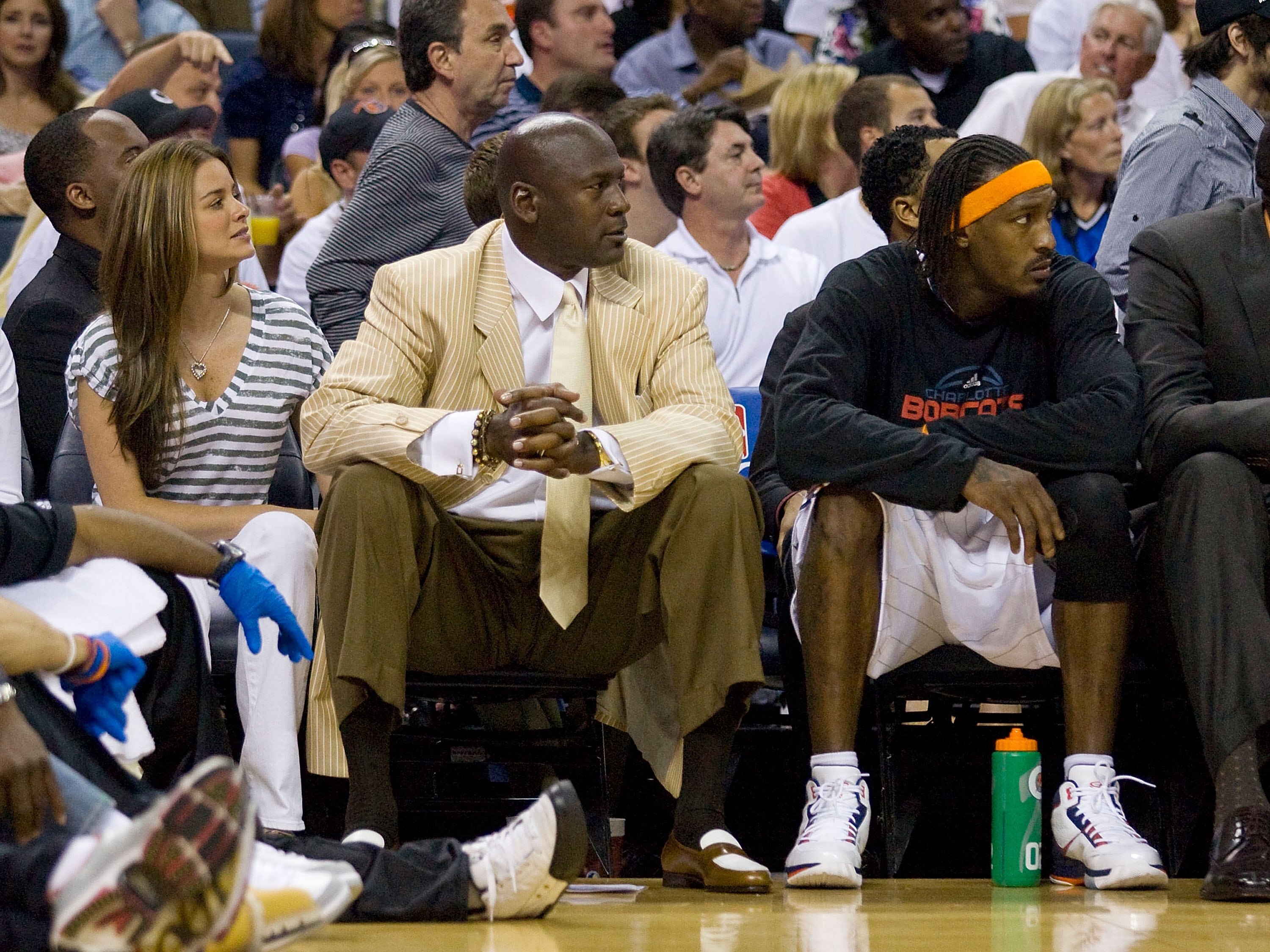 CHARLOTTE, NC - APRIL 26: Charlotte Bobcats owner Michael Jordan (left) and Gerald Wallce #3 watch the play against the Orlando Magic at Time Warner Cable Arena on April 26, 2010 in Charlotte, North Carolina.  The Magic defeated the Bobcats 99-90 to compl