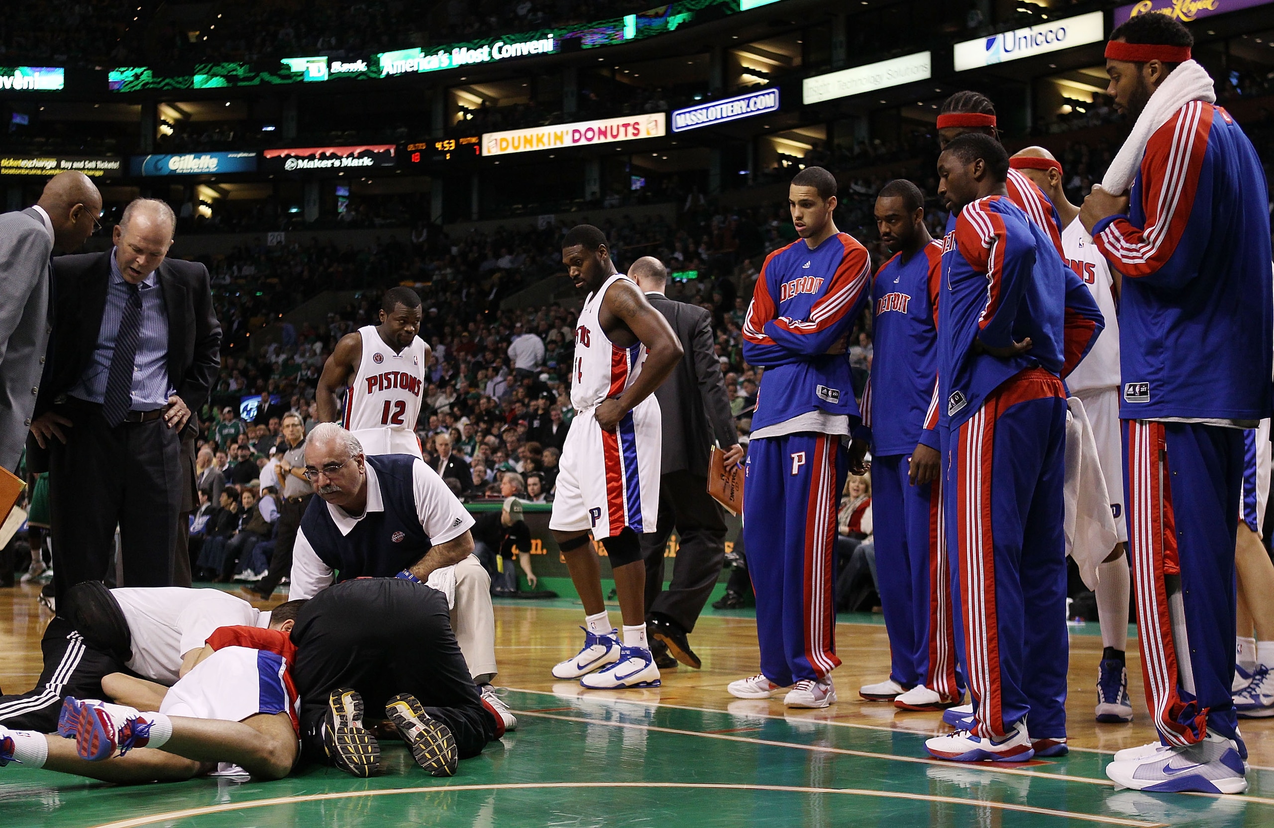 BOSTON - MARCH 15:  Teammates gather around as Tayshaun Prince #22 of the Detroit Pistons is looked after during the first quarter against the Boston Celtics  on March 15, 2010 at the TD Garden in Boston, Massachusetts.  NOTE TO USER: User expressly ackno