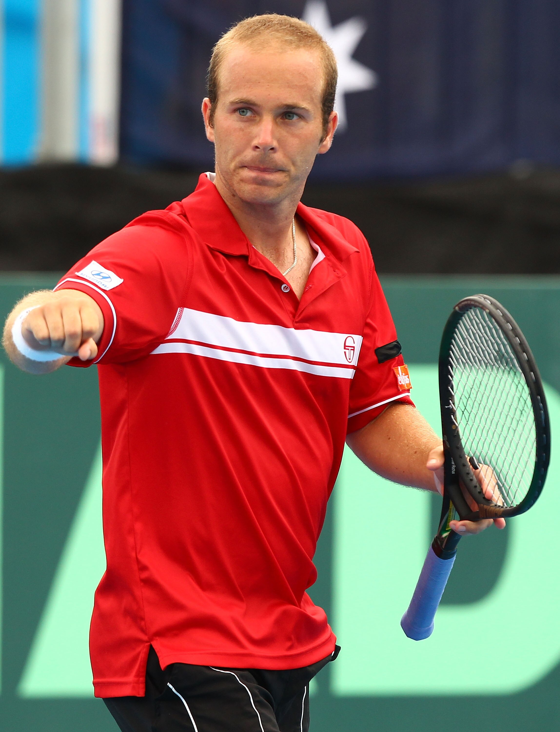 CAIRNS, AUSTRALIA - SEPTEMBER 20:  Olivier Rochus of Belgium celebrates a point in his match against Peter Luczak of Australia during day four of the Davis Cup tie between Australia and Belgium at Cairns International Tennis Centre on September 20, 2010 i
