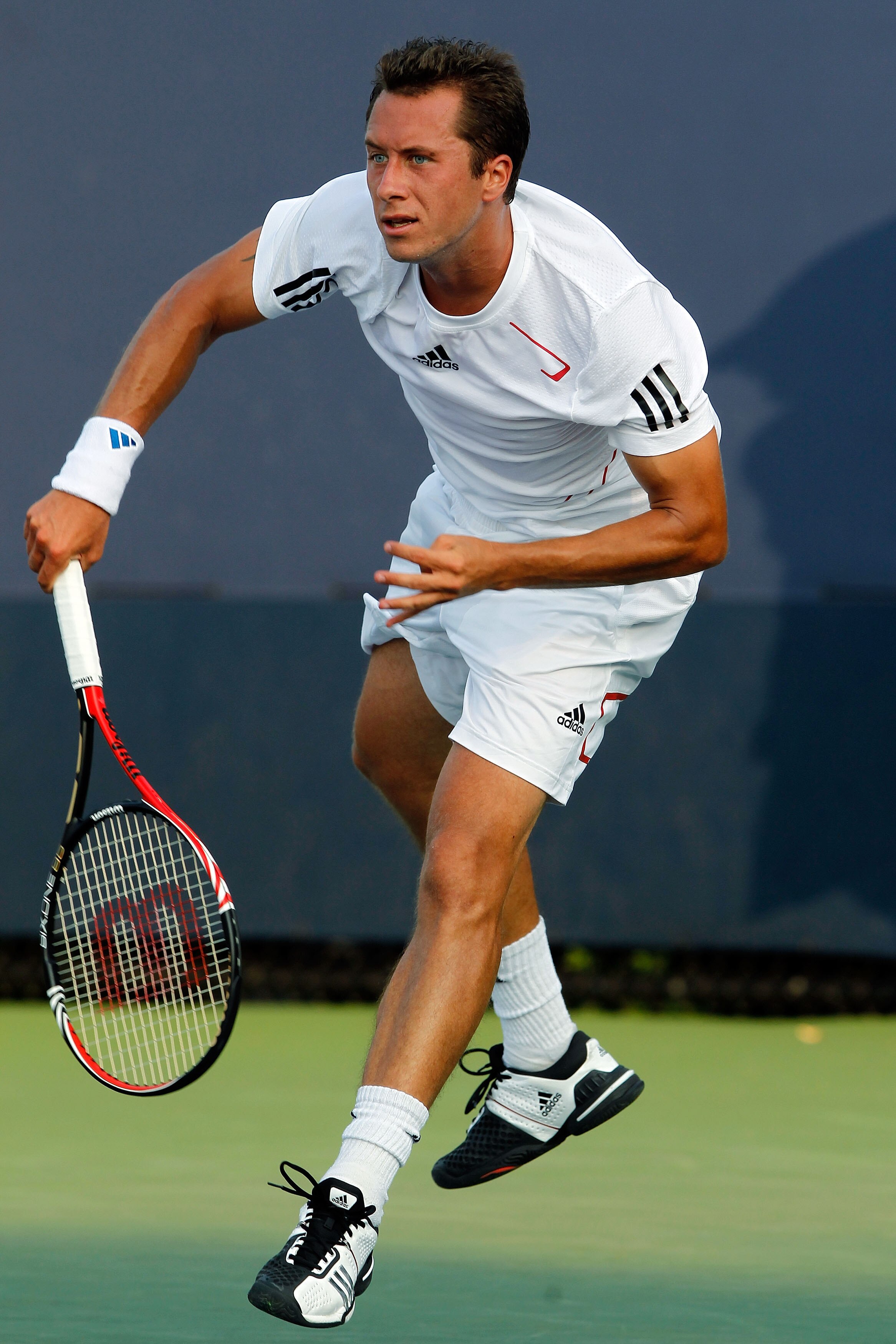 NEW YORK - SEPTEMBER 01:  Philipp Kohlschreiber of Germany serves against Tobias Kamke of Germany during his men's first round singles match on day three of the 2010 U.S. Open at the USTA Billie Jean King National Tennis Center on September 1, 2010 in the