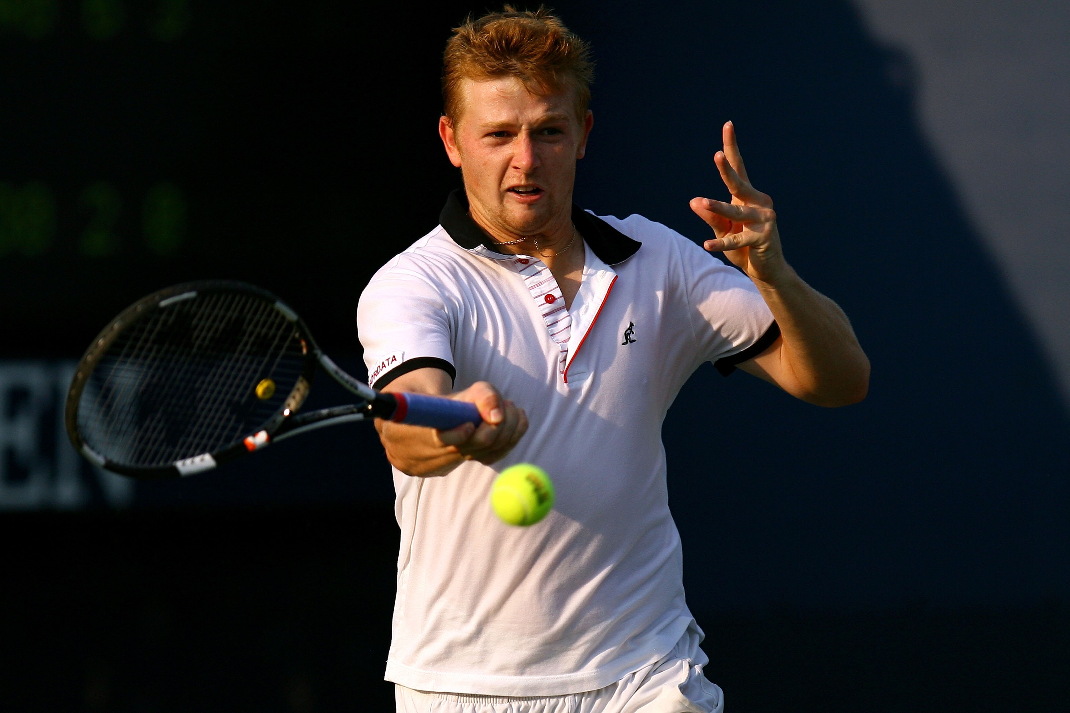 NEW YORK - SEPTEMBER 01:  Andrey Golubev of Kazakhstan returns a shot against Mikhail Youzhny of Russia during his men's singles first round match on day three of the 2010 U.S. Open at the USTA Billie Jean King National Tennis Center on September 1, 2010