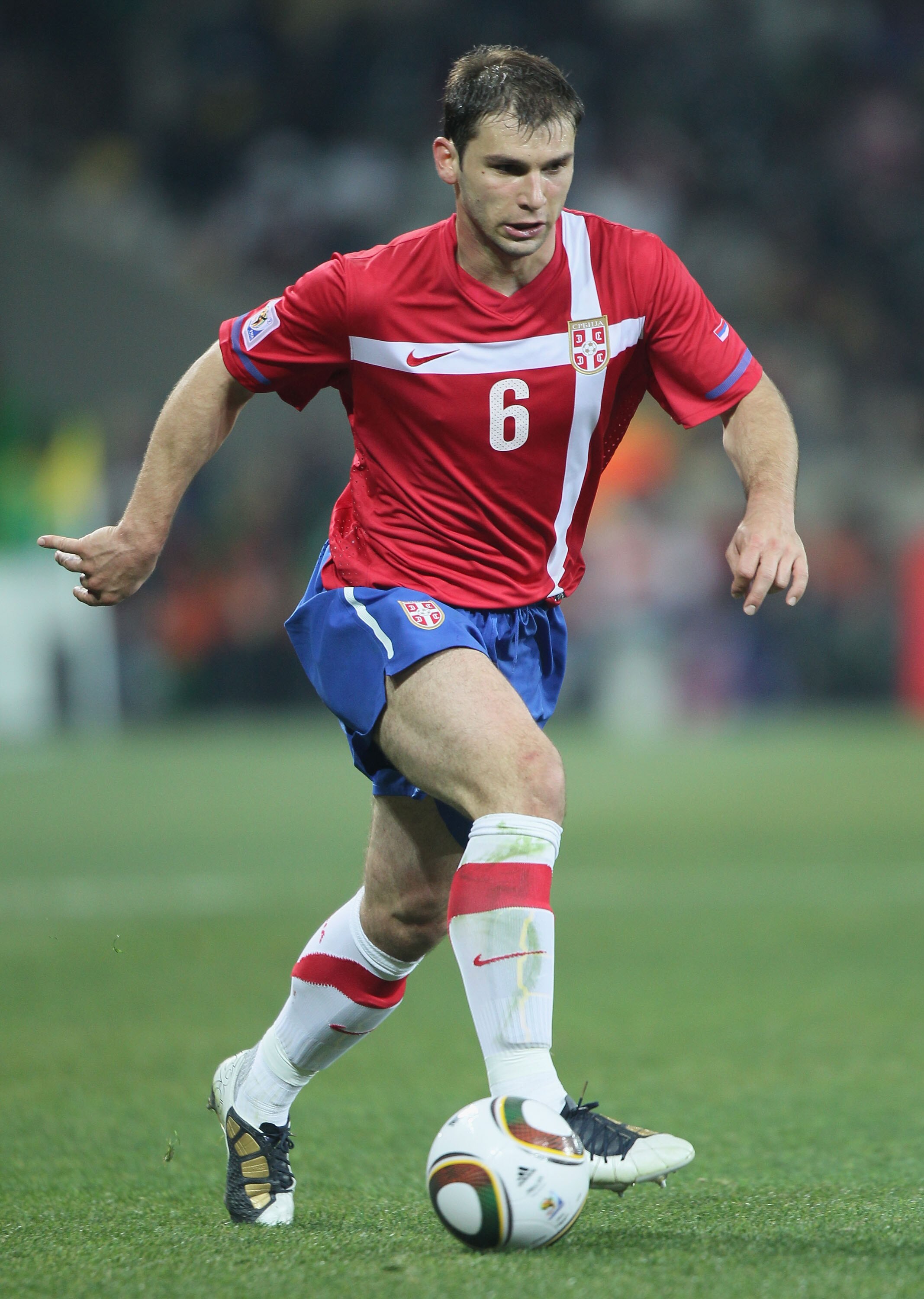 NELSPRUIT, SOUTH AFRICA - JUNE 23: Branislav Ivanovic of Serbia runs with the ball during the 2010 FIFA World Cup South Africa Group D match between Australia and Serbia at Mbombela Stadium on June 23, 2010 in Nelspruit, South Africa.  (Photo by Christof
