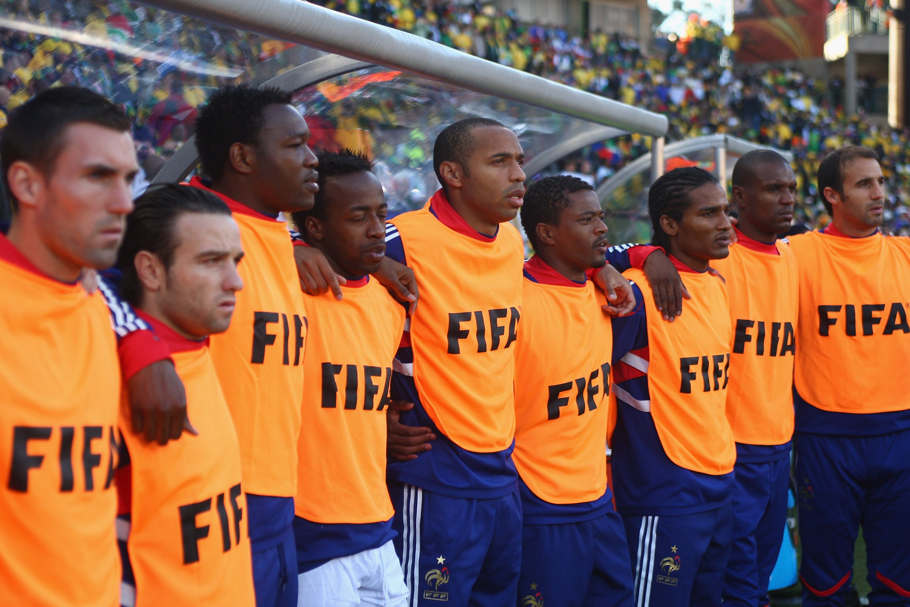 BLOEMFONTEIN, SOUTH AFRICA - JUNE 22:  Thierry Henry (c)of France  lines up during the national anthem alongside Sidney Govou (4th l), Patrice Evra (4th r) and Florent Malouda (3rd r) during the 2010 FIFA World Cup South Africa Group A match between Franc