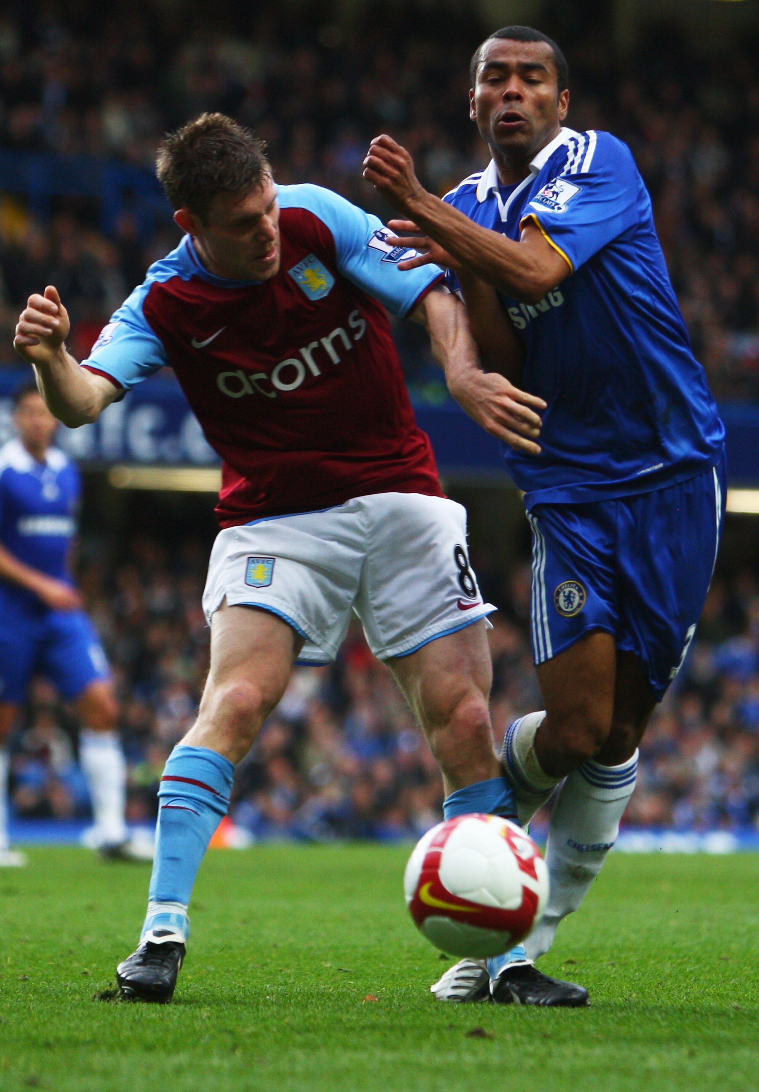 LONDON - OCTOBER 05:  Ashley Cole of Chelsea battles with James Milner of Aston Villa during the Barclays Premier League match between Chelsea and Aston Villa at Stamford Bridge on October 5, 2008 in London, England.  (Photo by Mike Hewitt/Getty Images)