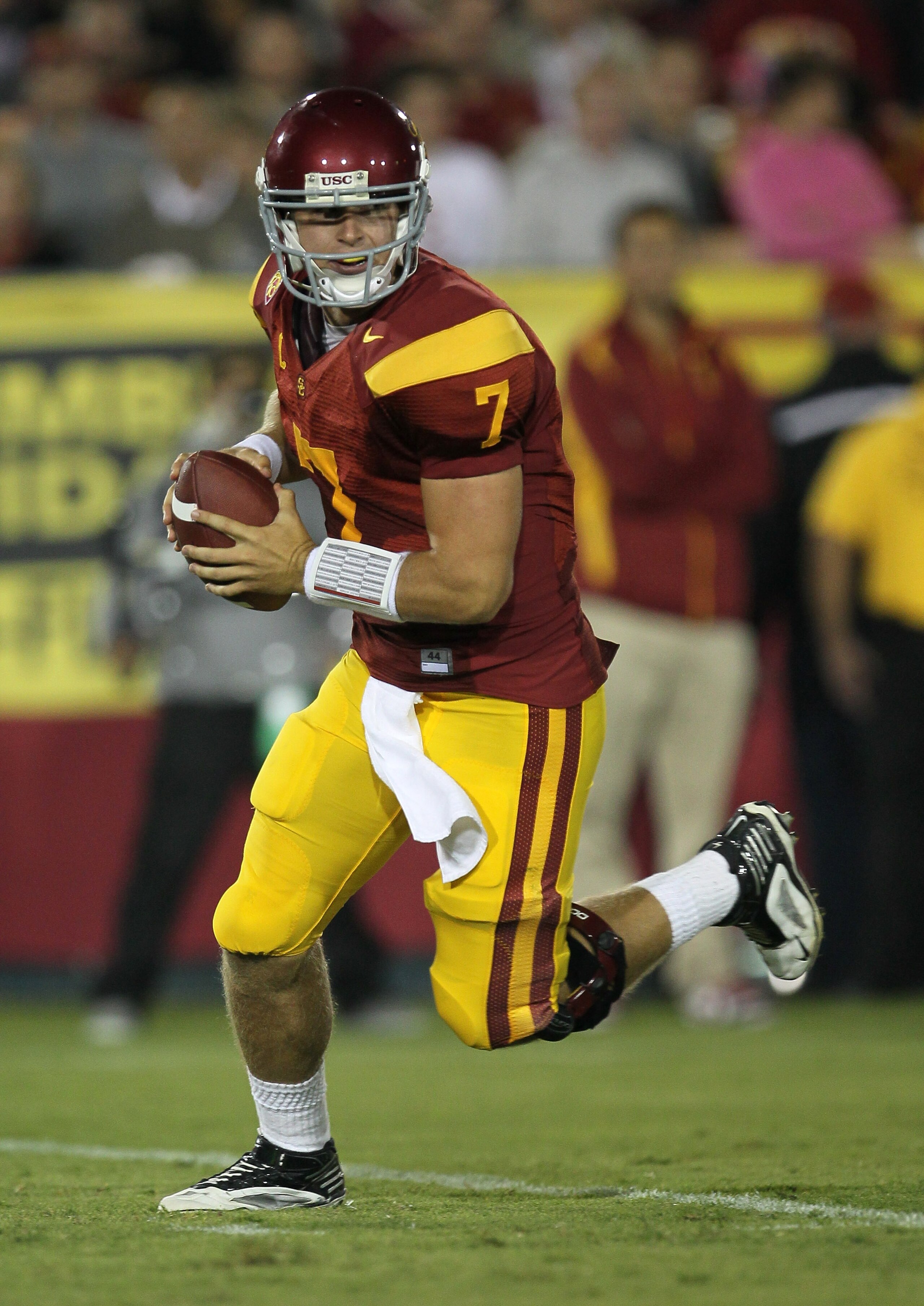 LOS ANGELES, CA - SEPTEMBER 11:  Quarterback Matt Barkley #7 of the USC Trojans rolls out against the Virginia Cavaliers at Los Angeles Memorial Coliseum on September 11, 2010 in Los Angeles, California. USC won 17-14.  (Photo by Stephen Dunn/Getty Images