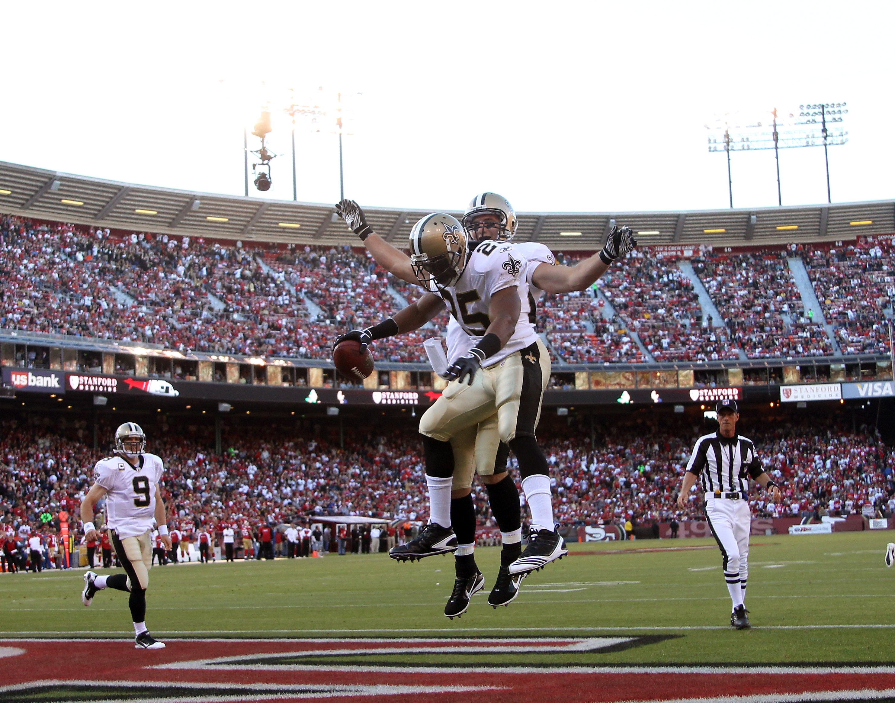 SAN FRANCISCO - SEPTEMBER 20:  Reggie Bush #25 and David Thomas #85 of the New Orleans Saints celebrate after Rush scored a touchdown against the San Francisco 49ers at Candlestick Park on September 20, 2010 in San Francisco, California.  (Photo by Ezra S