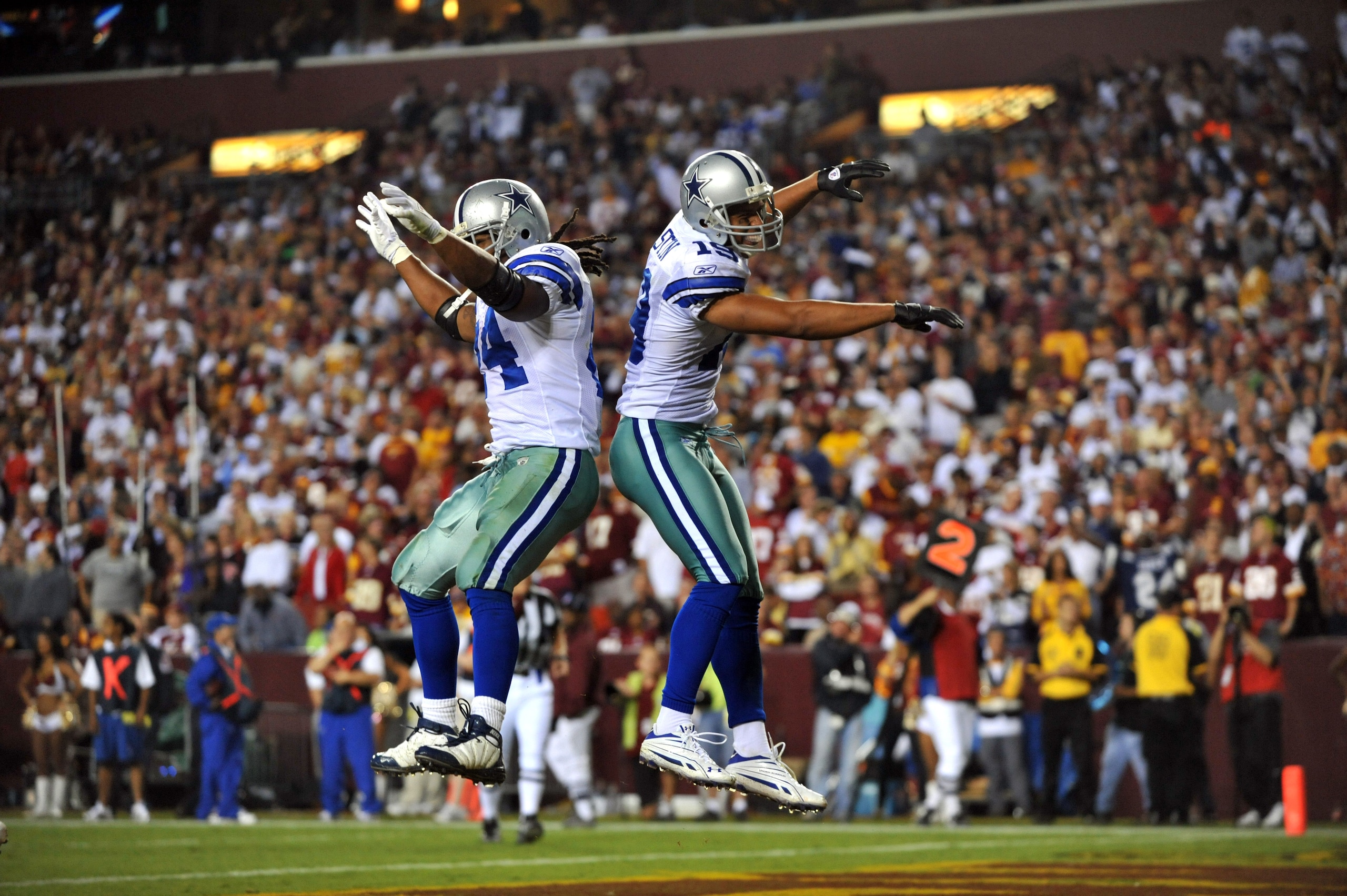 LANDOVER - SEPTEMBER 12:  Miles Austin #19 of the Dallas Cowboys celebrates his touchdown during the NFL season opener against the Washington Redskins at FedExField on September 12, 2010 in Landover, Maryland. The Redskins defeated the Cowboys 13-7. (Phot