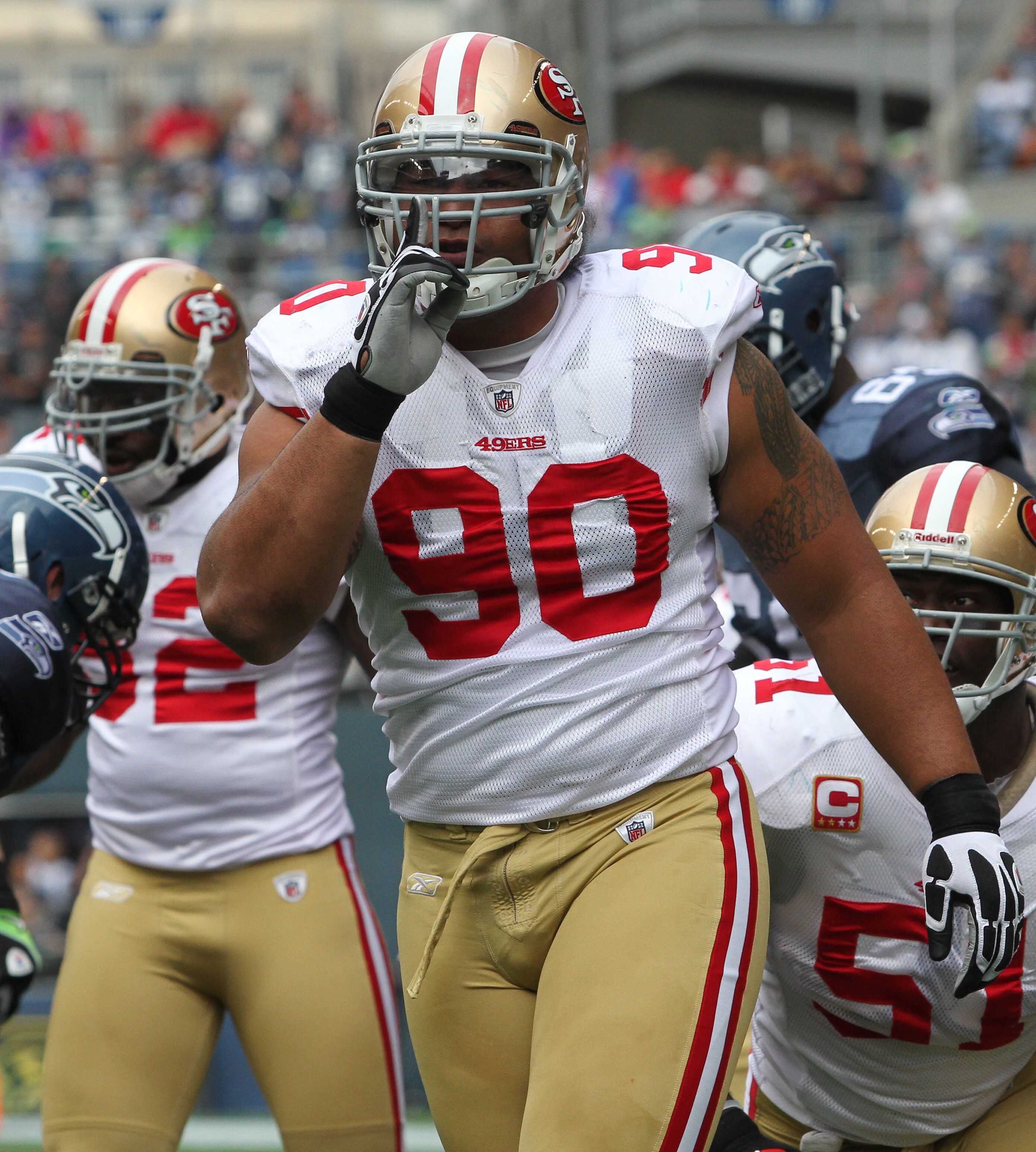 SEATTLE - SEPTEMBER 12:  Defensive tackle Isaac Sopoaga #90 of the San Francisco 49ers shushes the crowd during the NFL season opener against the Seattle Seahawks at Qwest Field on September 12, 2010 in Seattle, Washington. (Photo by Otto Greule Jr/Getty