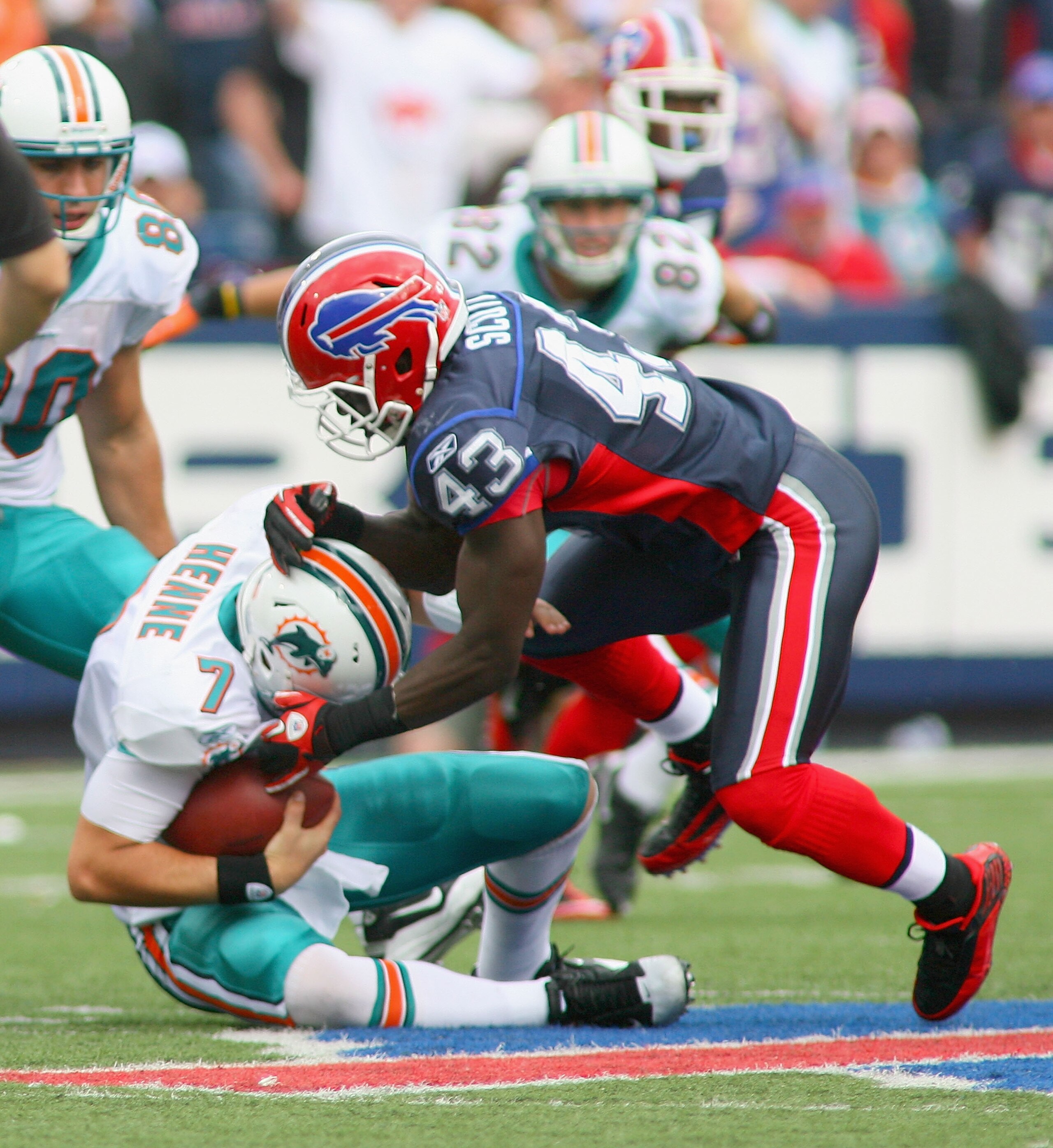 ORCHARD PARK, NY - SEPTEMBER 12: Bryan Scott #43  of the Buffalo Bills sacks Chad Henne #7 of the Miami Dolphins during the NFL season opener at Ralph Wilson Stadium on September 12, 2010 in Orchard Park, New York. Miami won 15-10. (Photo by Rick Stewart/