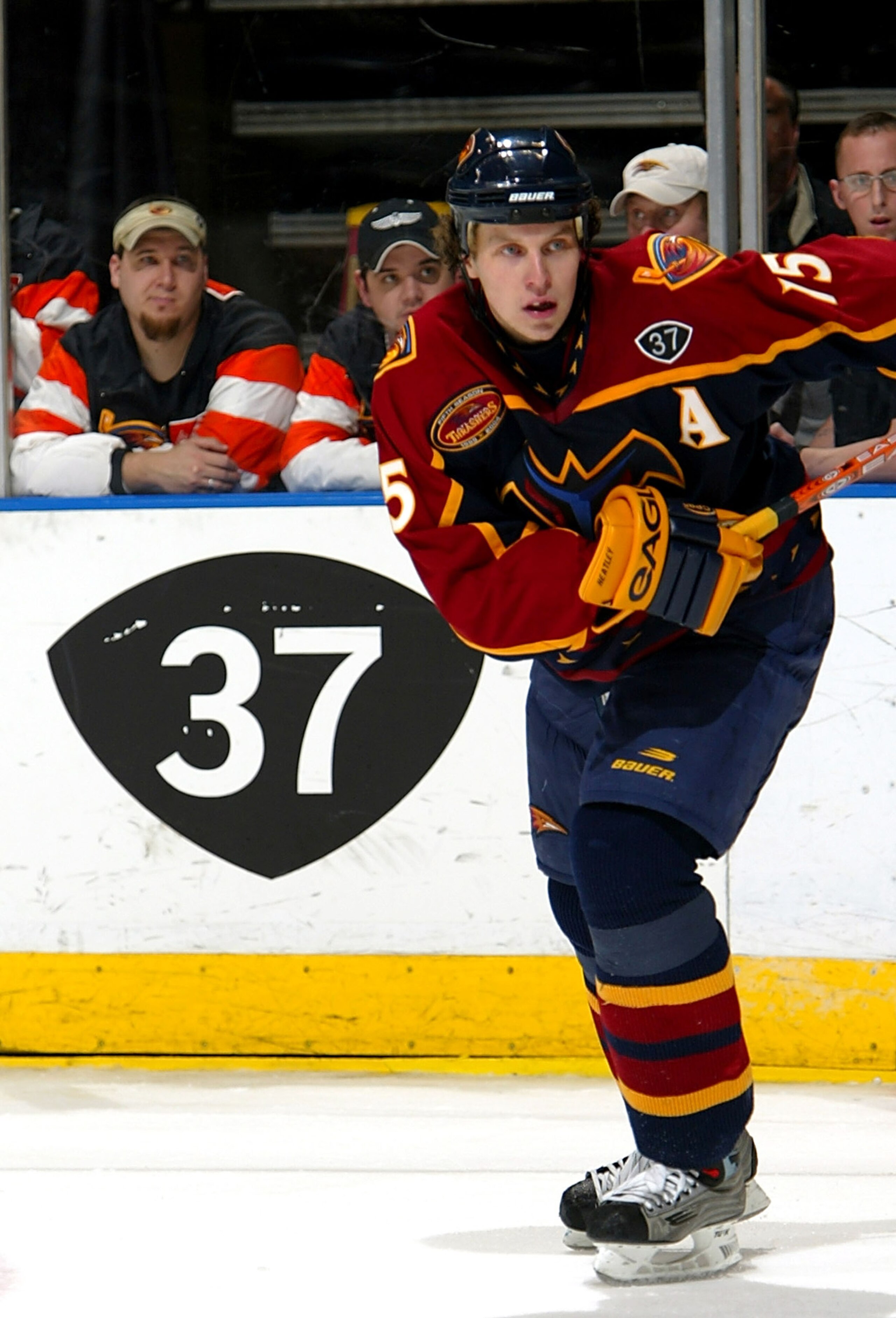 ATLANTA - JANUARY 28:  Dany Heatley #15 of the Atlanta Thrashers skates by a sign honoring the number of deceased player Dan Snyder #37 during a game against the St. Louis Blues on January 28, 2004 at Philips Arena in Atlanta, Georgia.  (Photo by Jamie Sq