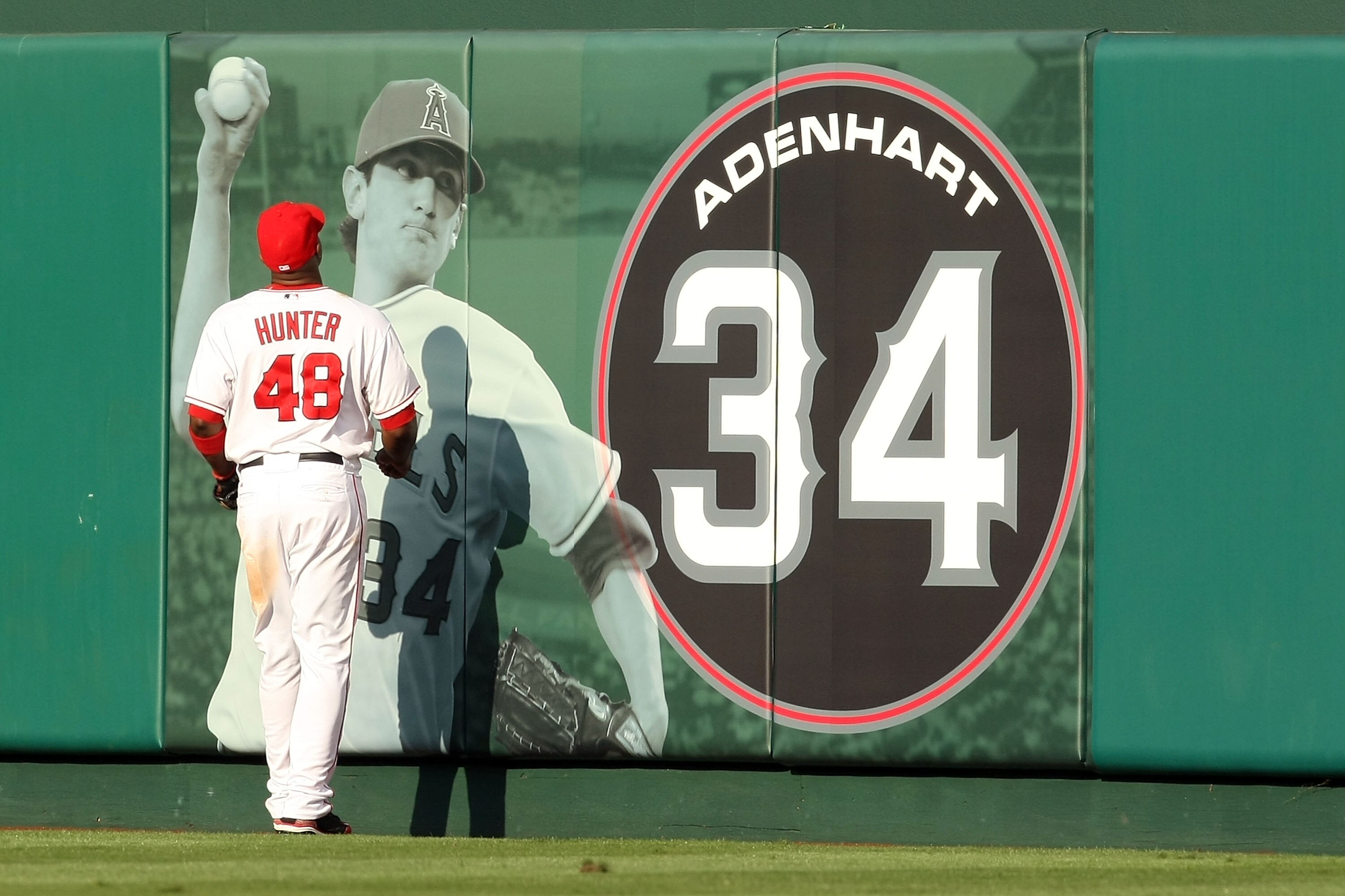 ANAHEIM, CA - OCTOBER 19:  Torii Hunter #48 of the Los Angeles Angels of Anaheim looks up at the Nick Adenhart display during the game against the New York Yankees in Game Three of the ALCS during the 2009 MLB Playoffs at Angel Stadium on October 19, 2009
